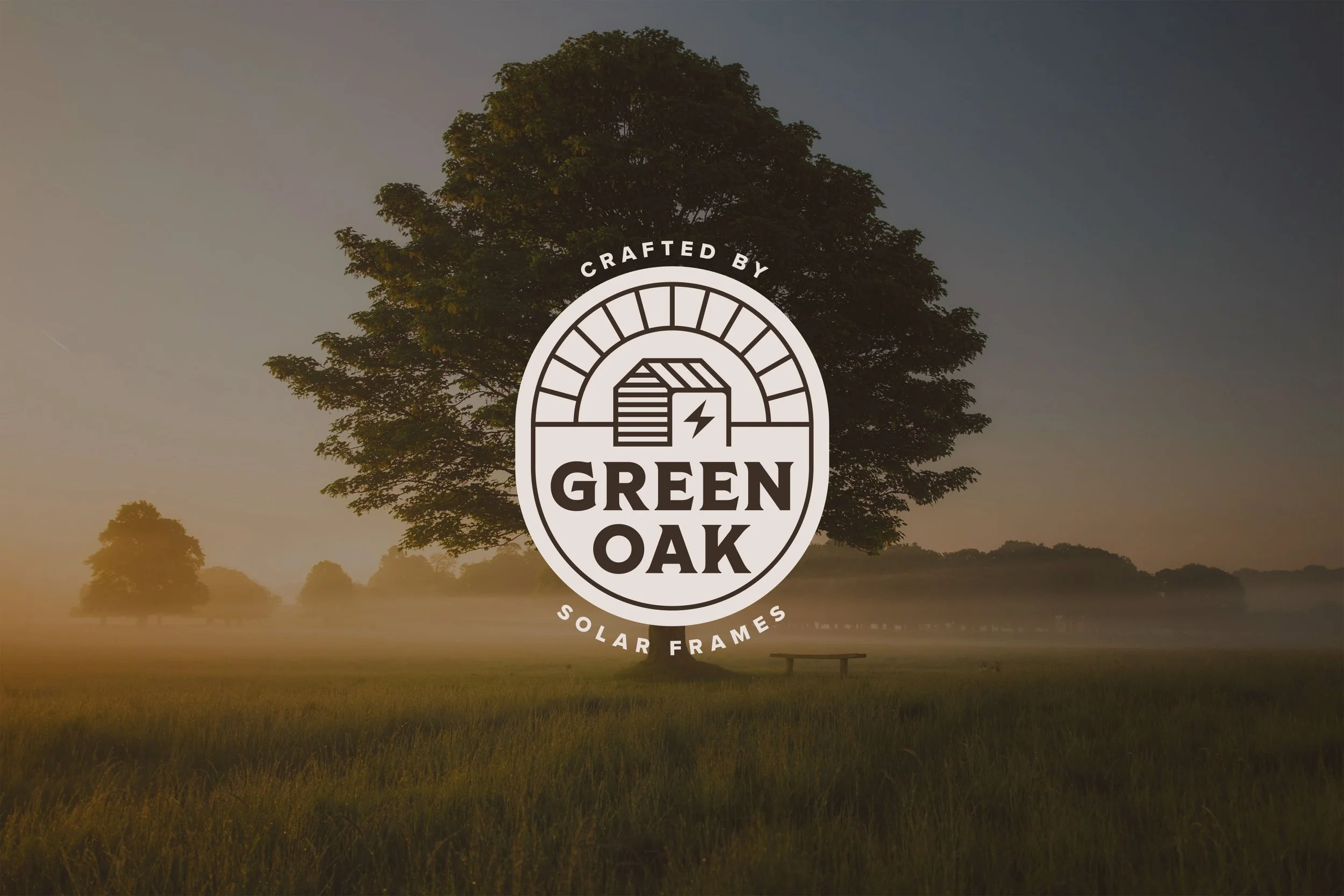 A large tree in a foggy field at sunrise with "Crafted by Green Oak Solar Frames" logo overlaid.