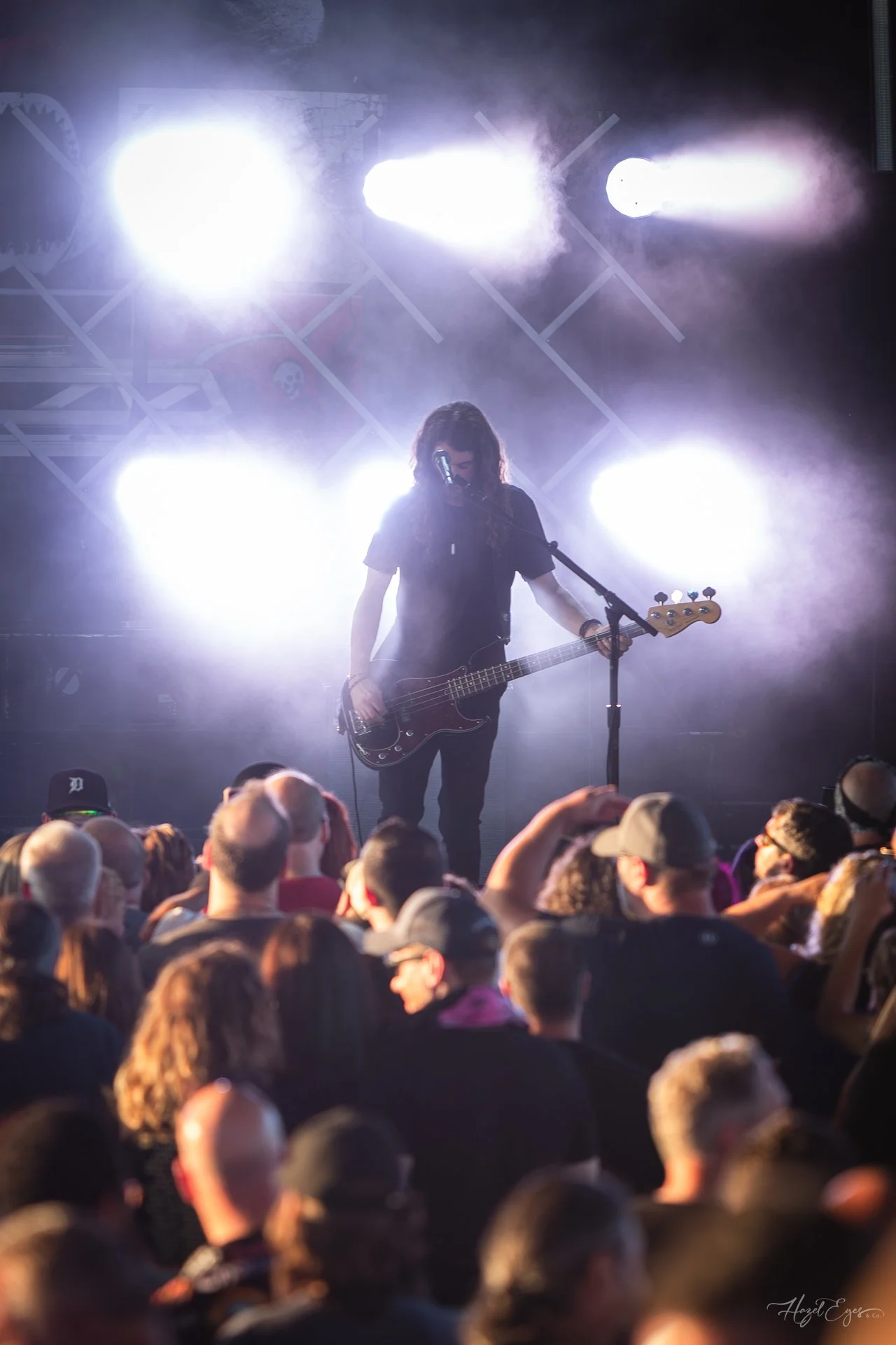 Jerry Cantrell in concert at Michigan Lottery Amphitheatre at Freedom Hill in Sterling Heights, MI on August 16, 2024. Guitarist on stage backlit with bright stage lighting.