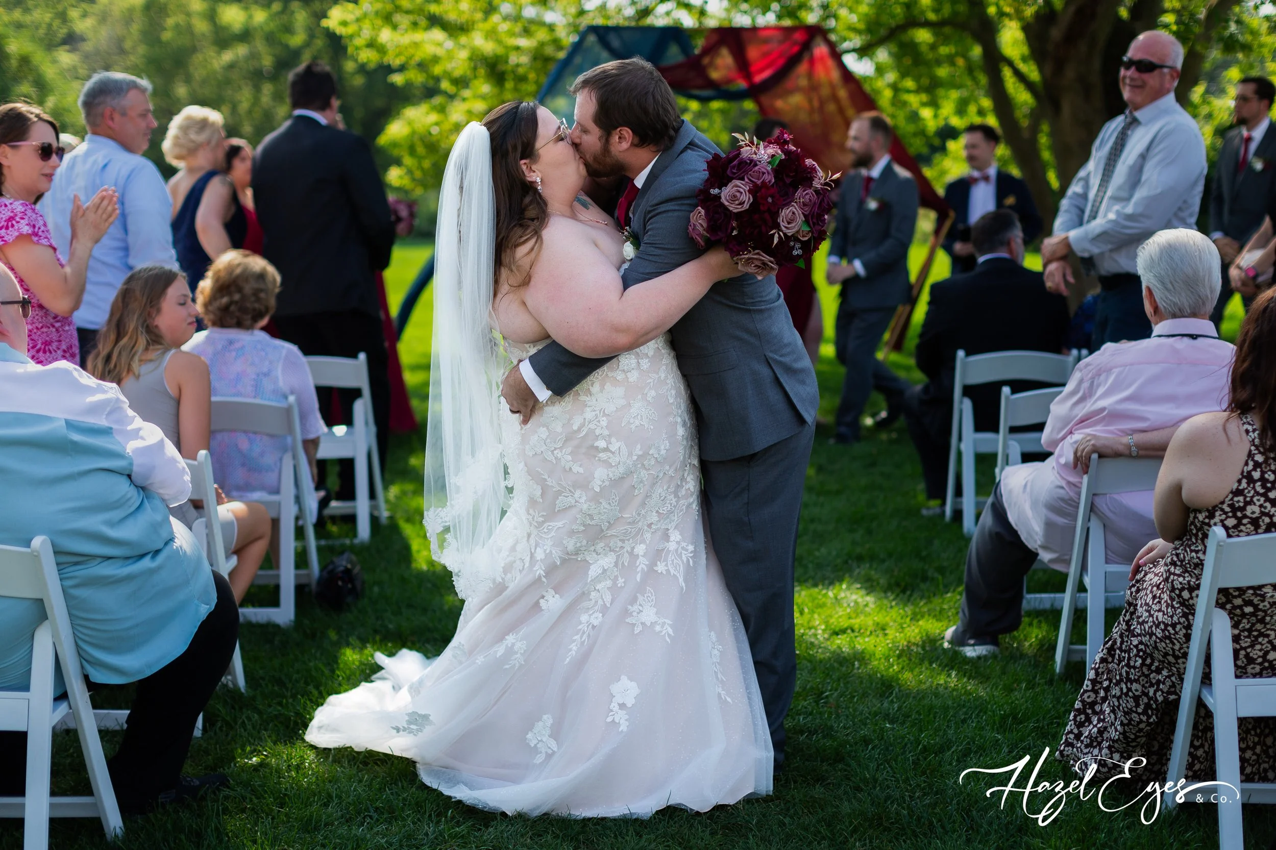 Michigan outdoor wedding. bride dress. groom suit. bride’s dress. Michigan wedding photographer. Hazel Eyes & Co. August wedding. Summer wedding.  Creekside Acres Event Barn Goodrich, MI 48438