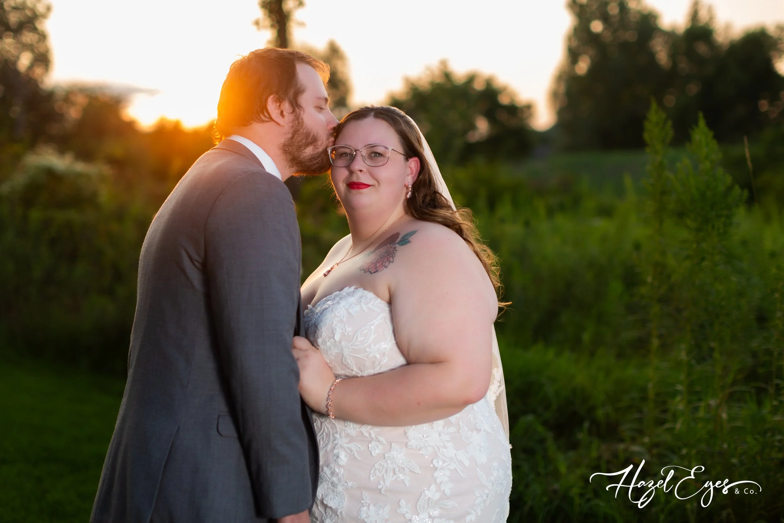 bride groom sunset photos creekside barn Goodrich wedding plus-size plus size grey gray suit