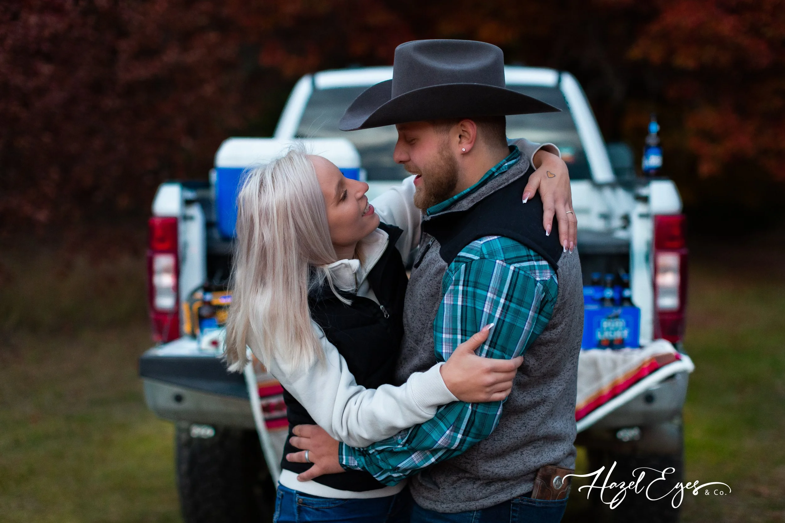country engagement bud light truck cowboy hat flannel plaid cooler diamond in my pocket heart of gold white truck woods