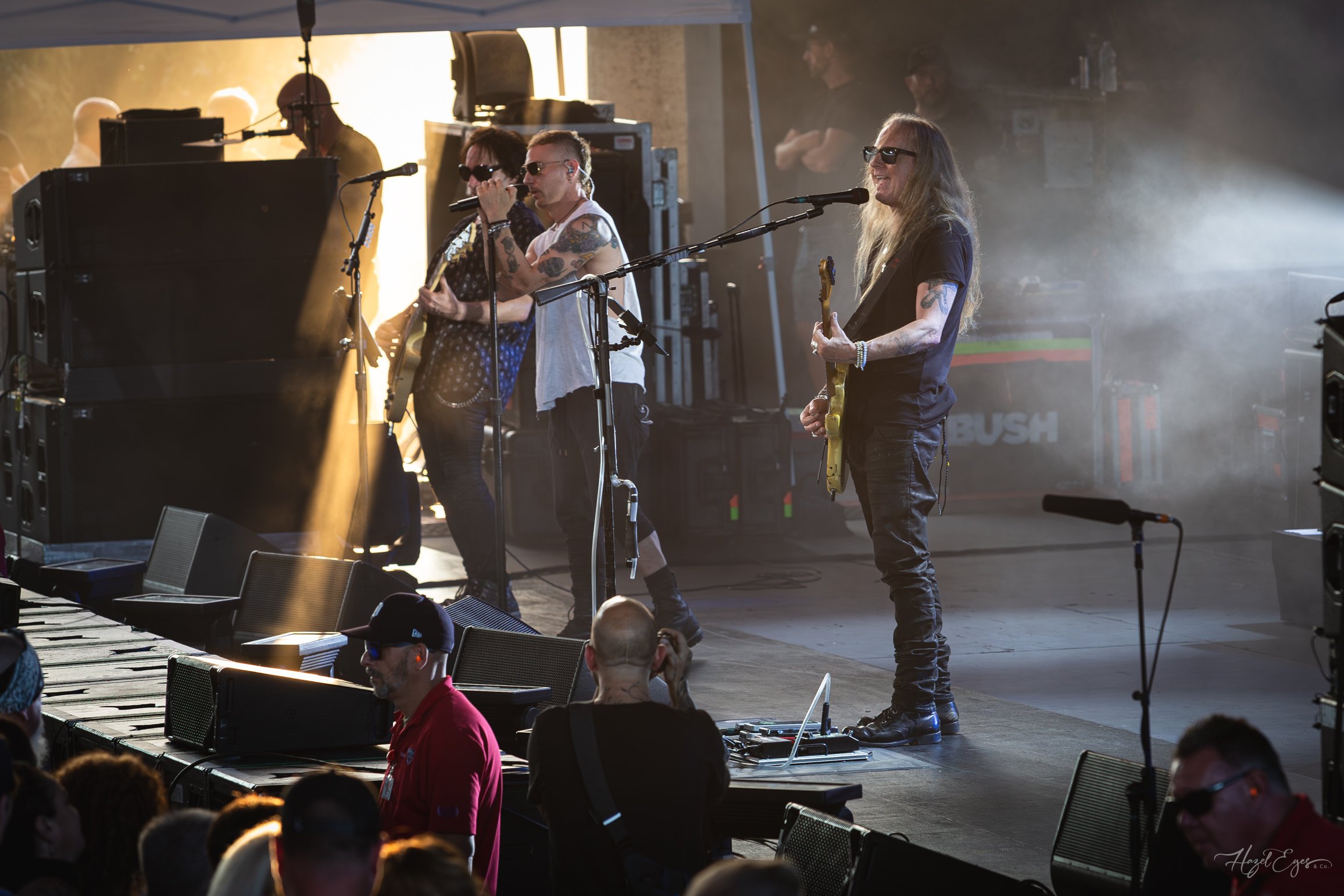 Jerry Cantrell in concert at Michigan Lottery Amphitheatre at Freedom Hill in Sterling Heights, MI on August 16, 2024. Guitarist on stage backlit with bright stage lighting with rays of sunlight shining on stage from the side.
