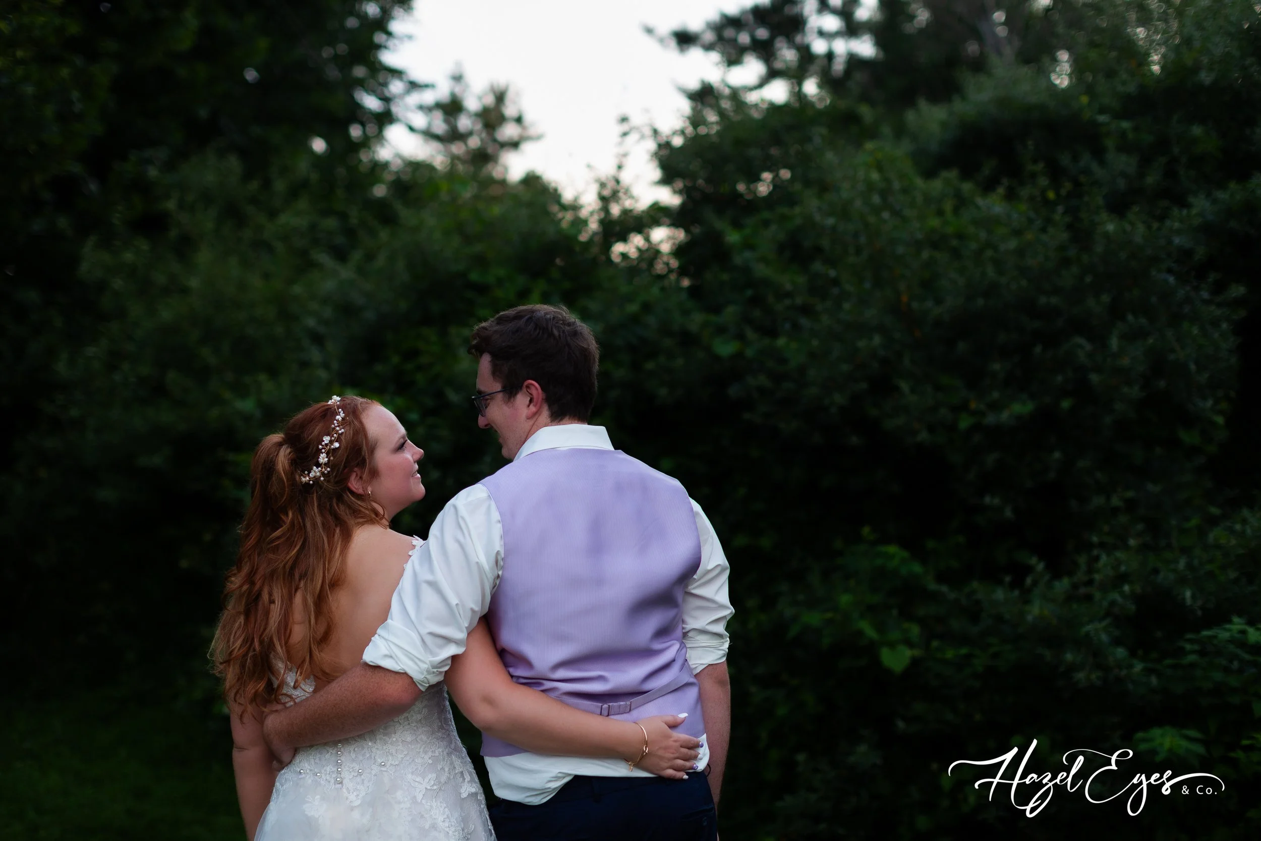 Michigan country barn wedding. Bride and groom photo. Wedding reception. Groom vest. Bridal dress. bride’s dress. Groom vest. First dance. Michigan wedding photographer. Hazel Eyes & Co. July wedding. Our Little Girl Event Barn Clifford, MI 48727