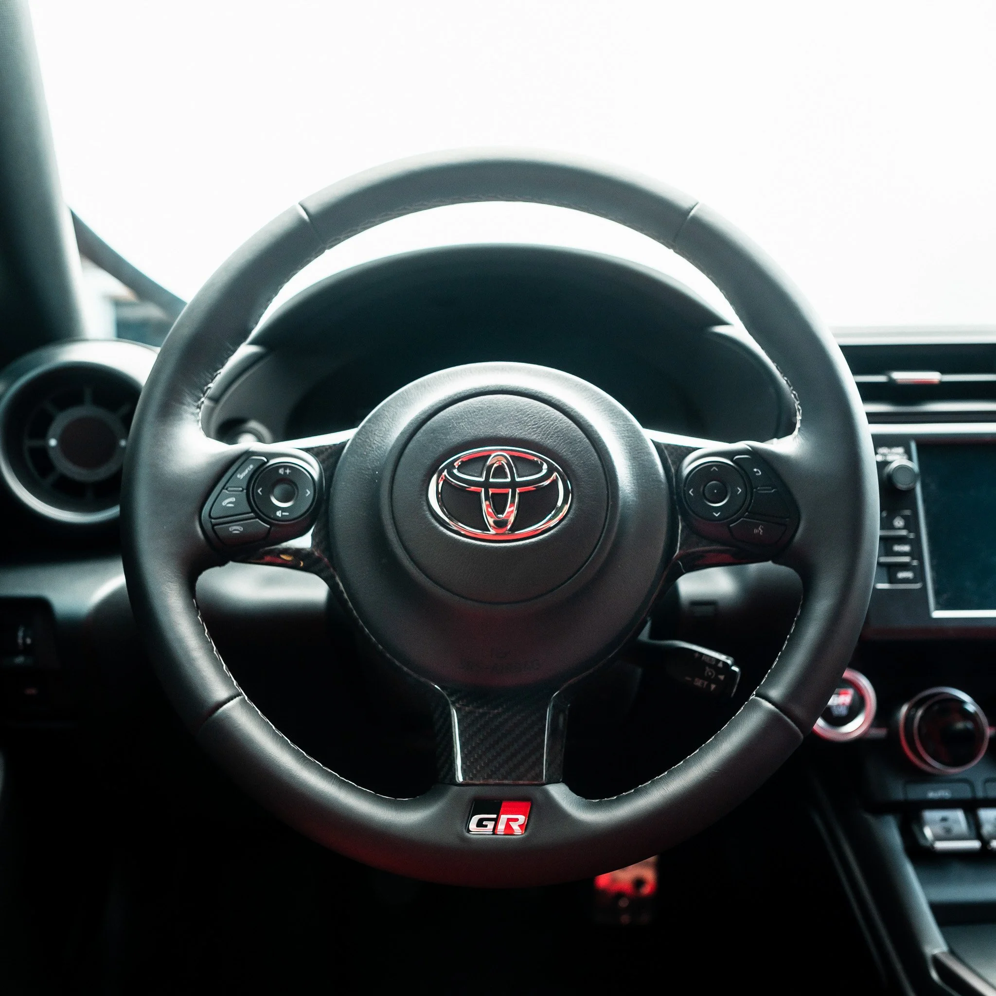 22+ GR86/BRZ Carbon Fiber Steering Wheel Trim — driven.media