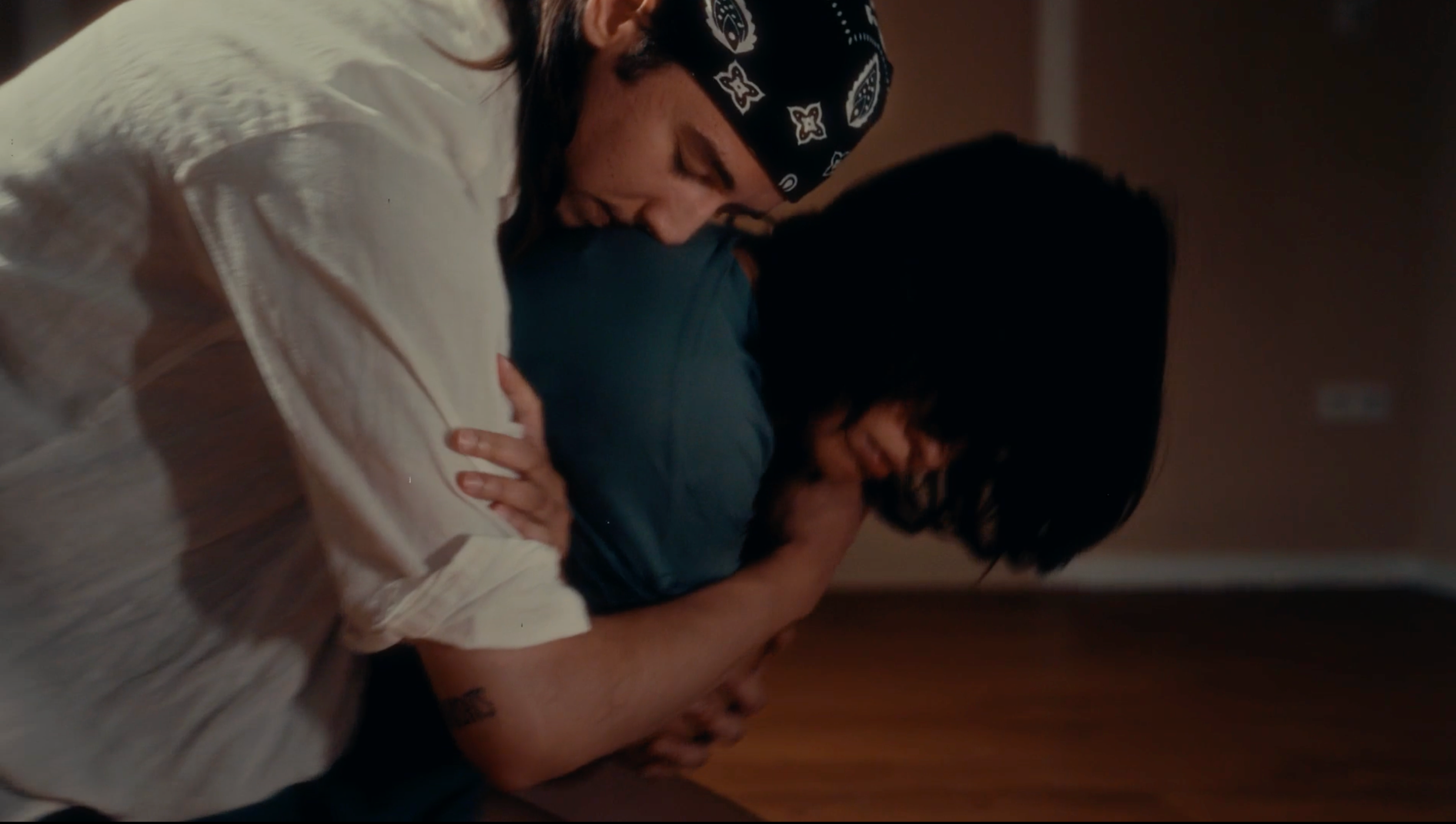 Marlo hugging Isolde from behind.