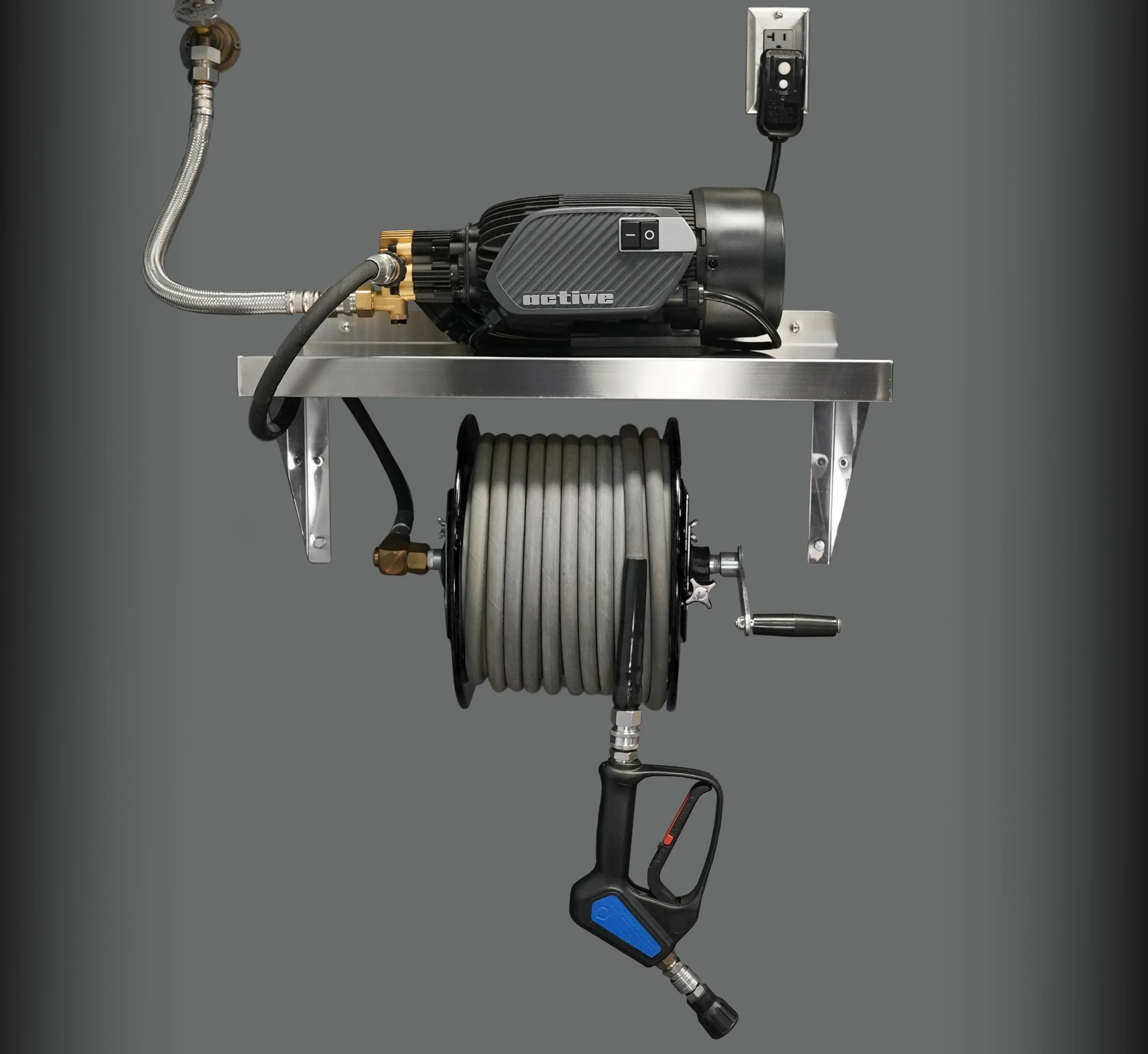 A medical device with metal tubing, a black ribbed component labeled 'active,' a switch, and a foot pedal, mounted on a metal stand against a gray background.