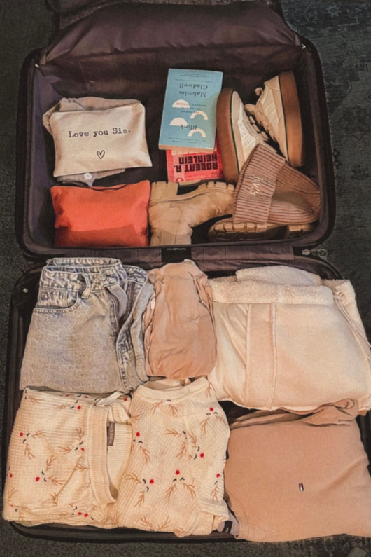 Open suitcase representing early eating disorder recovery and identity reflection