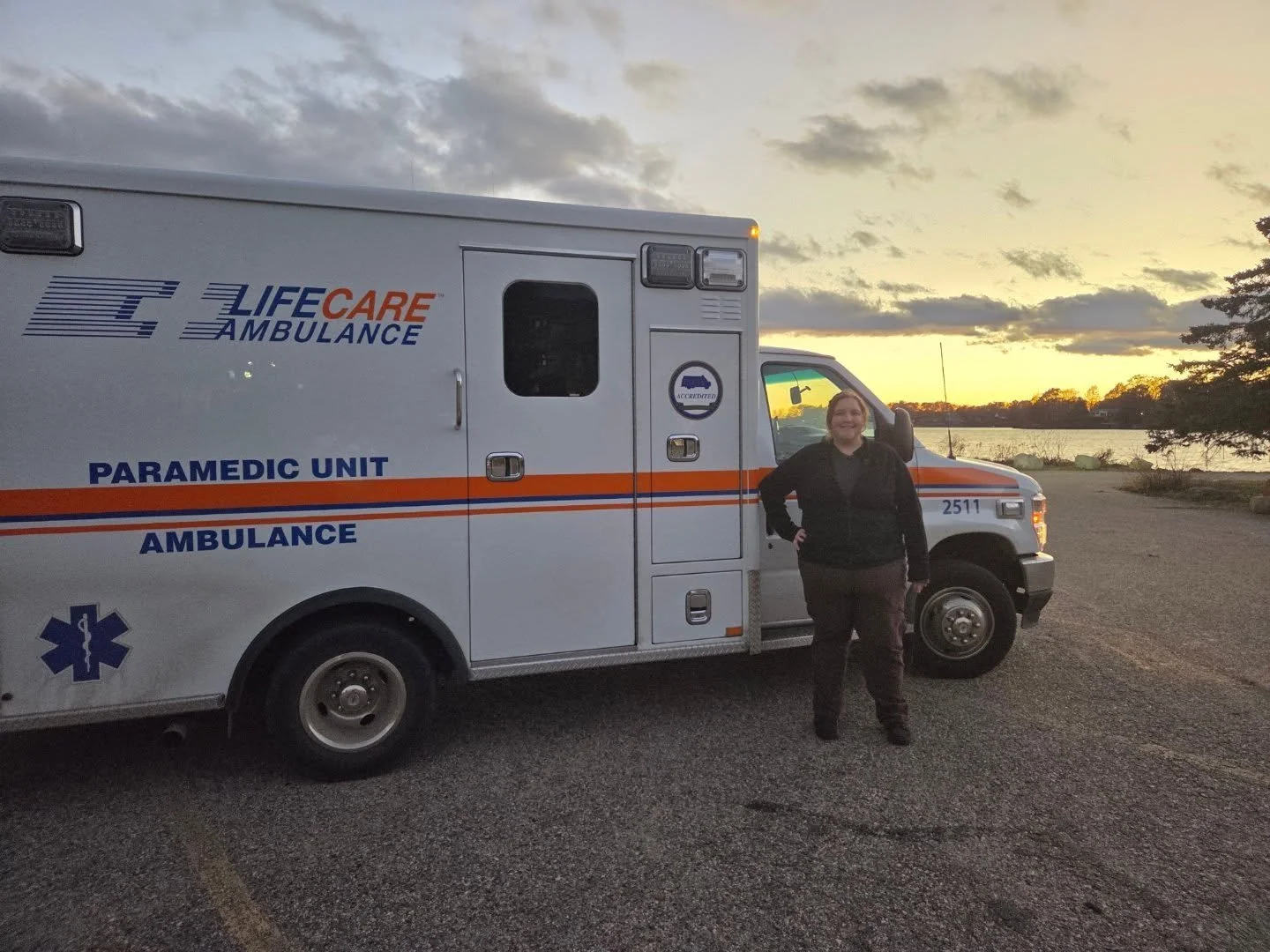 Alicia Kennedy, LLMSW, therapist at Set Apart Counseling, near a first responder ambulance in Kalamazoo, Michigan