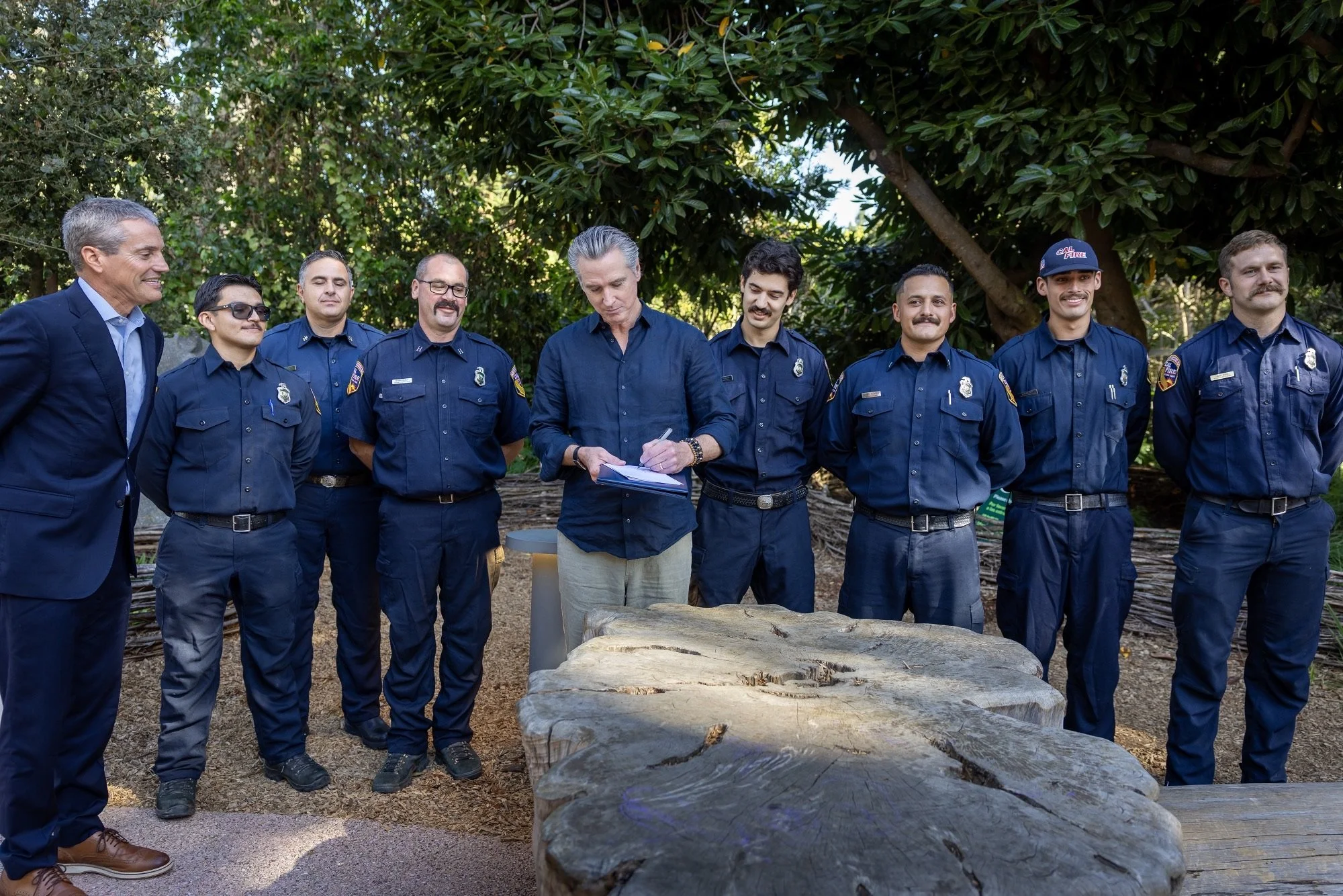 Photograph of Governor Newsom signing disaster bills