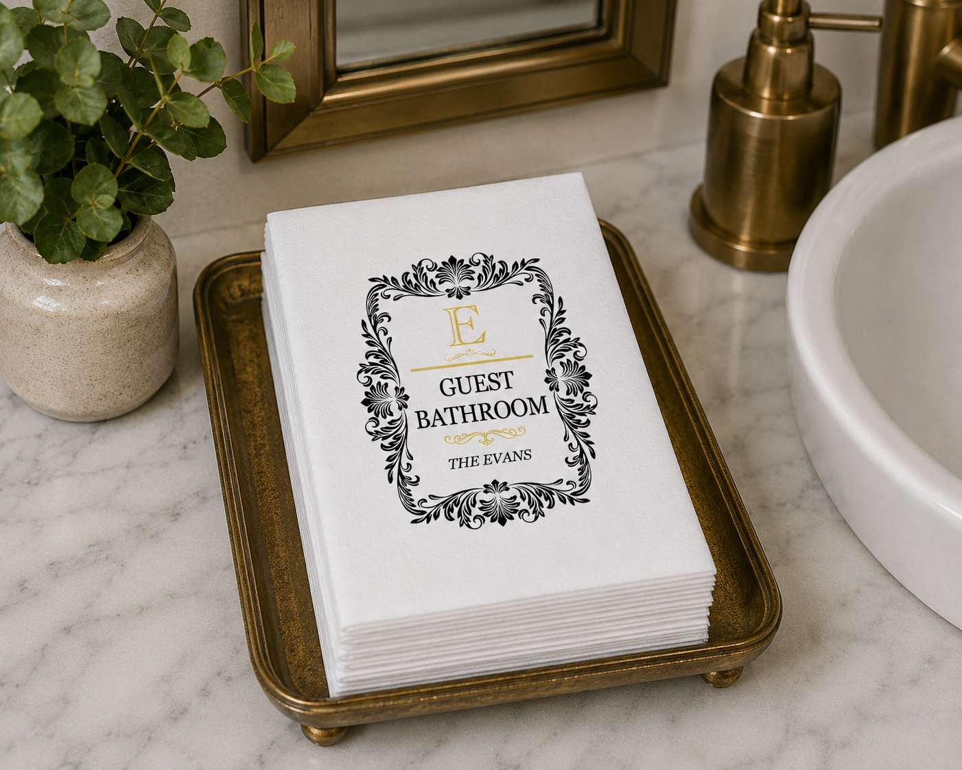Cozy modern bathroom styling with personalized disposable guest towels arranged neatly on a decorative tray near a contemporary sink and soap dispenser.