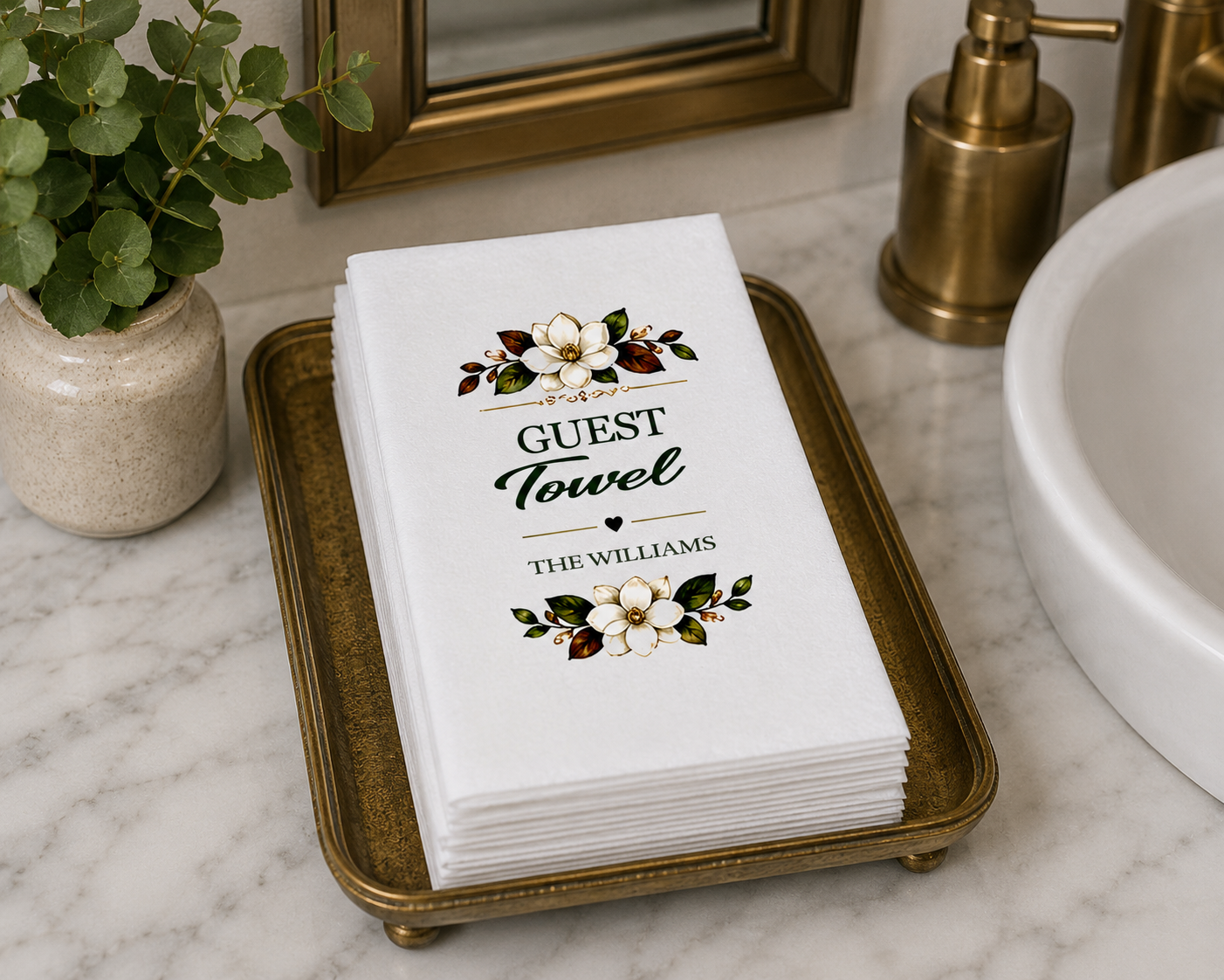 Sophisticated bathroom countertop scene featuring custom rectangular guest towels with botanical artwork and upscale spa-like accents.