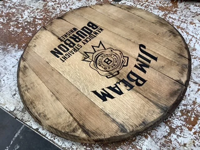 Jim Beam barrel lid close-up wood grain bourbon decor