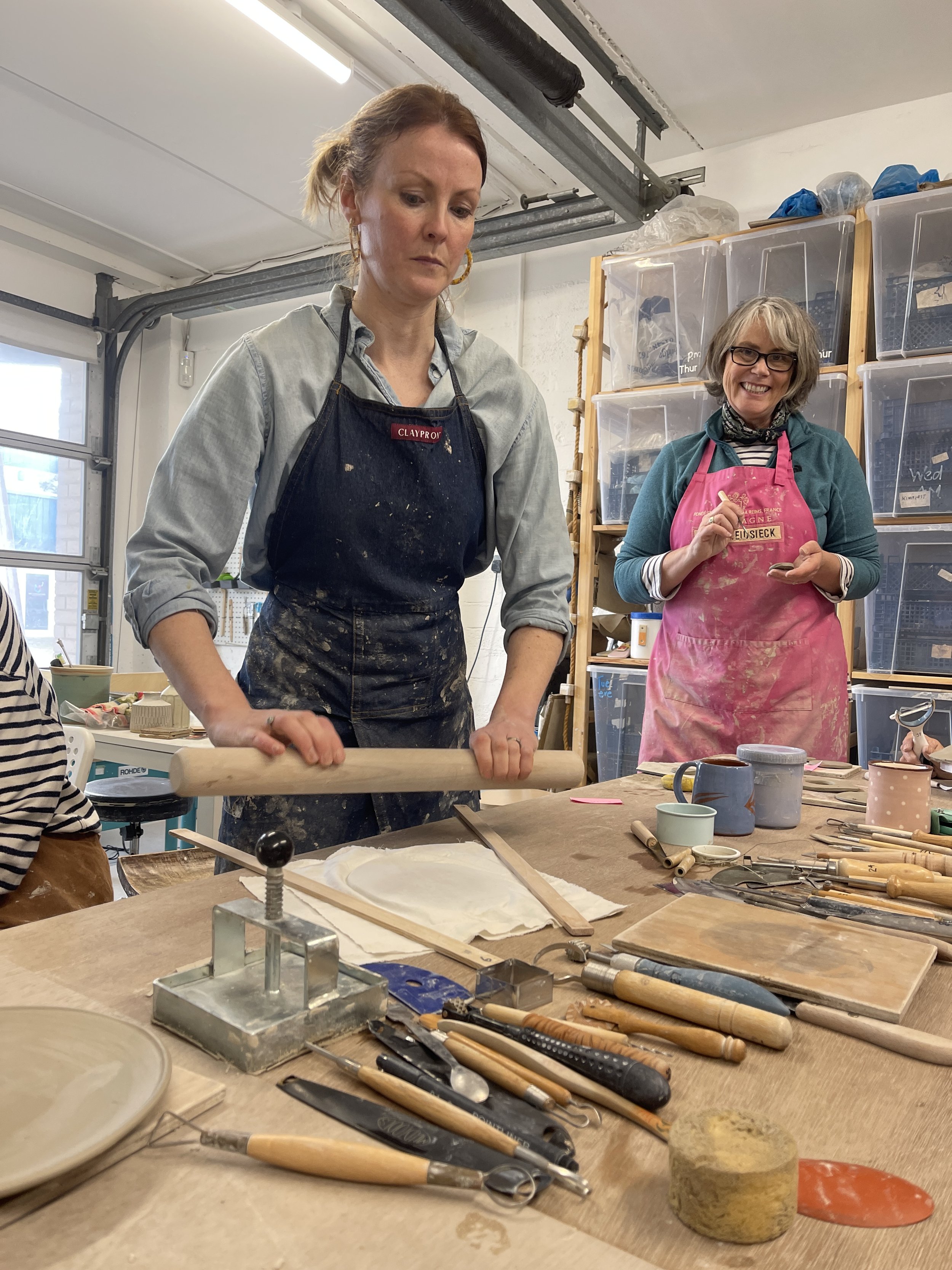 Hilda demonstrating a slab formed piece for sgraffito.