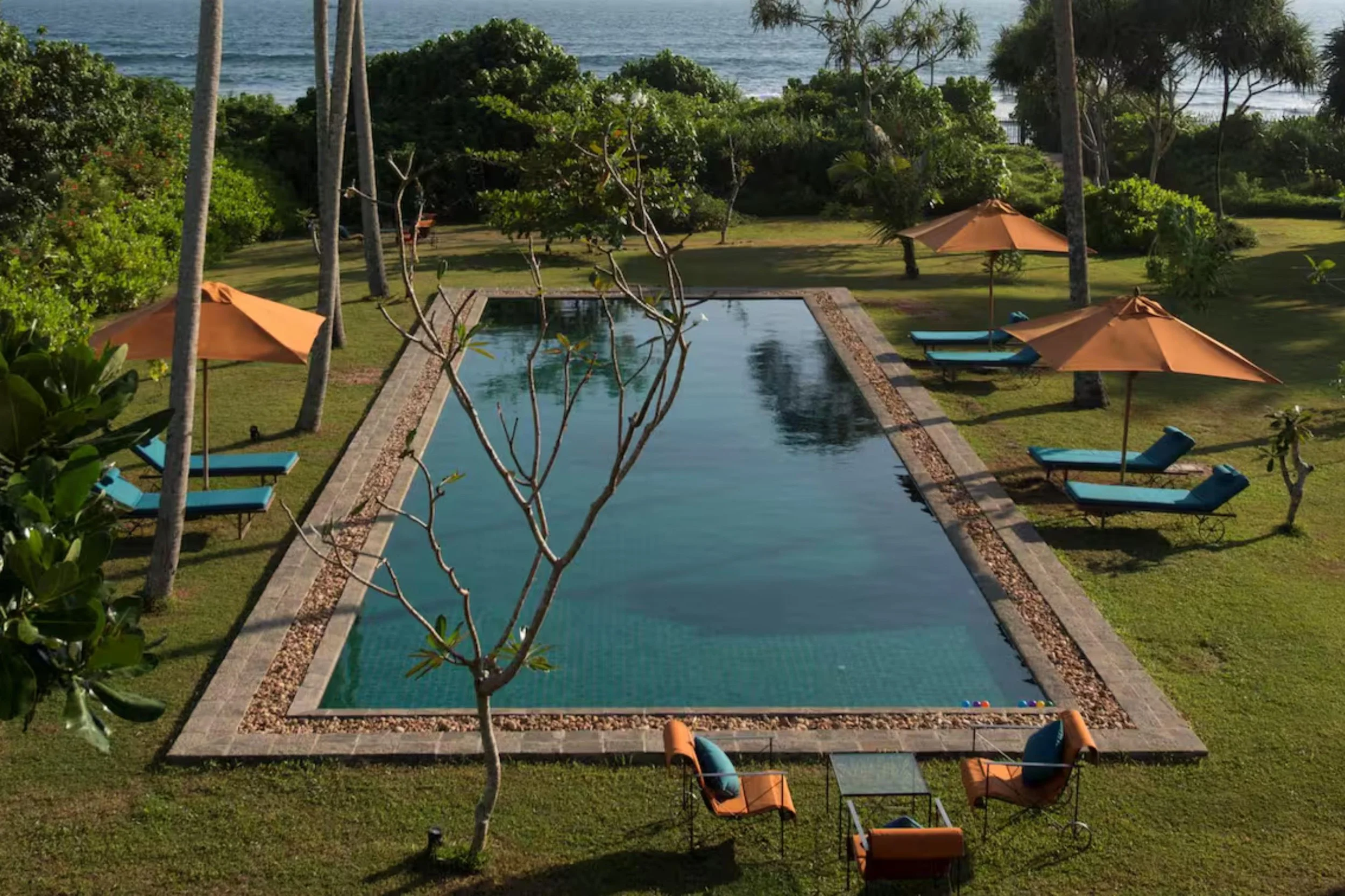 A pair of elegantly designed beachfront villas offered for sale