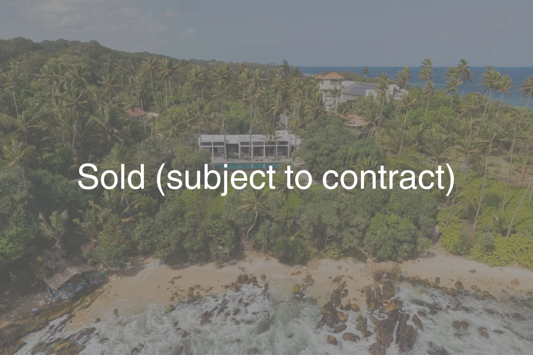 Contemporary elevated beachfront villa for sale