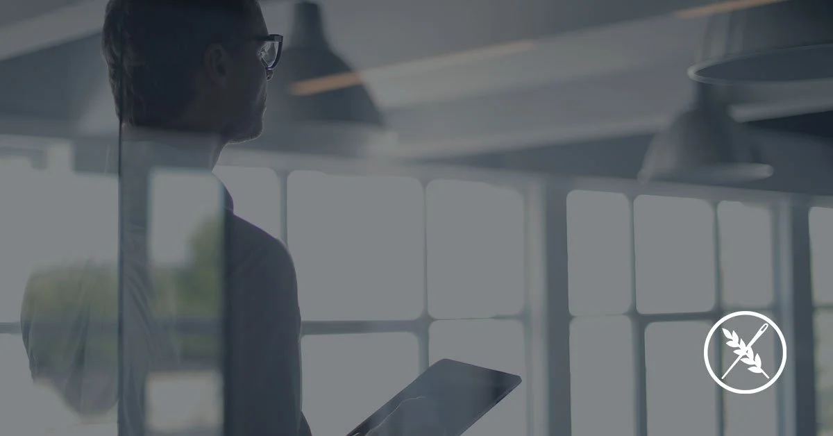 man with tablet in office