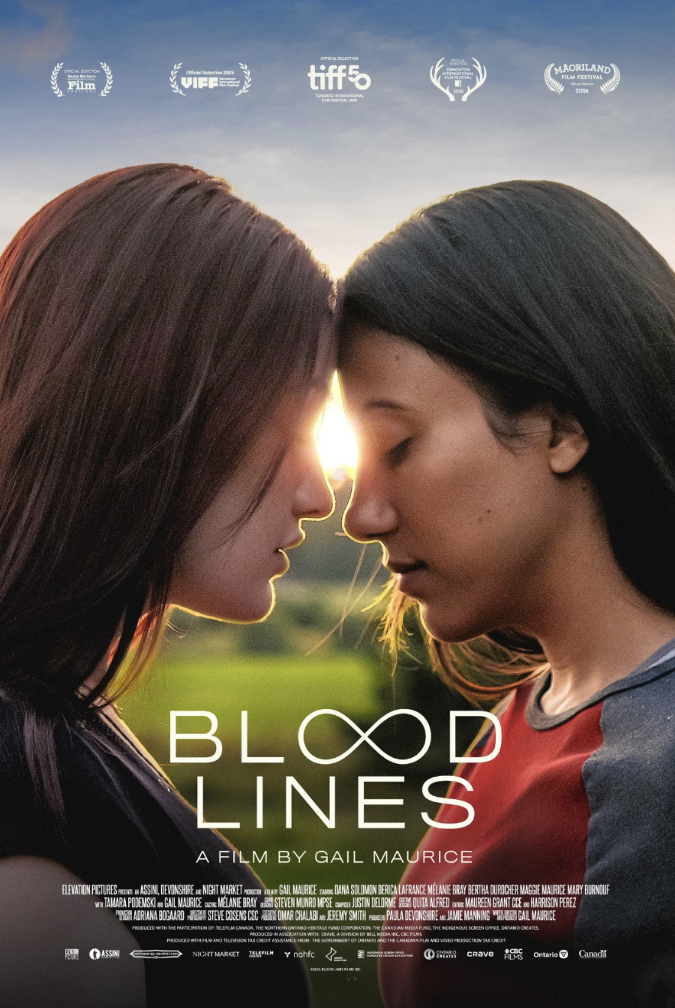 Two women with eyes closed touching foreheads, glowing light between them at sunrise or sunset, promoting the film 'Blood Lines' directed by Gail Maurice.