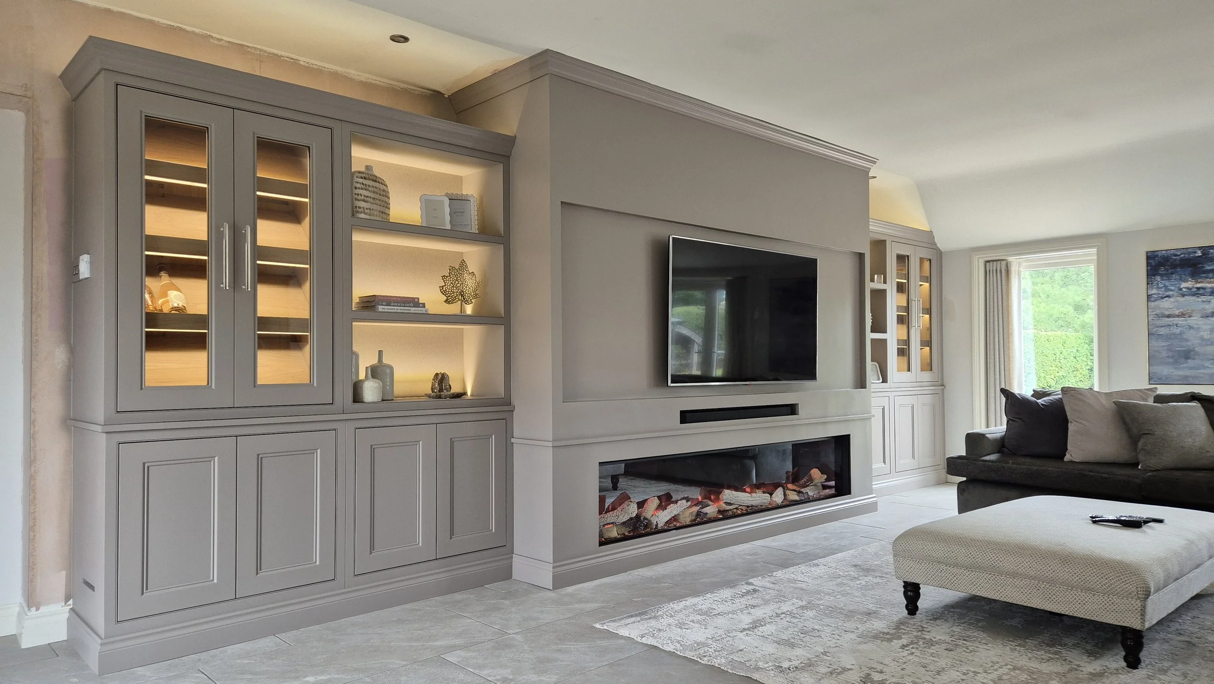 Bespoke media wall in Knutsford with 2.4m Evonic fire, 60-inch TV, LED lighting and integrated wine coolers.