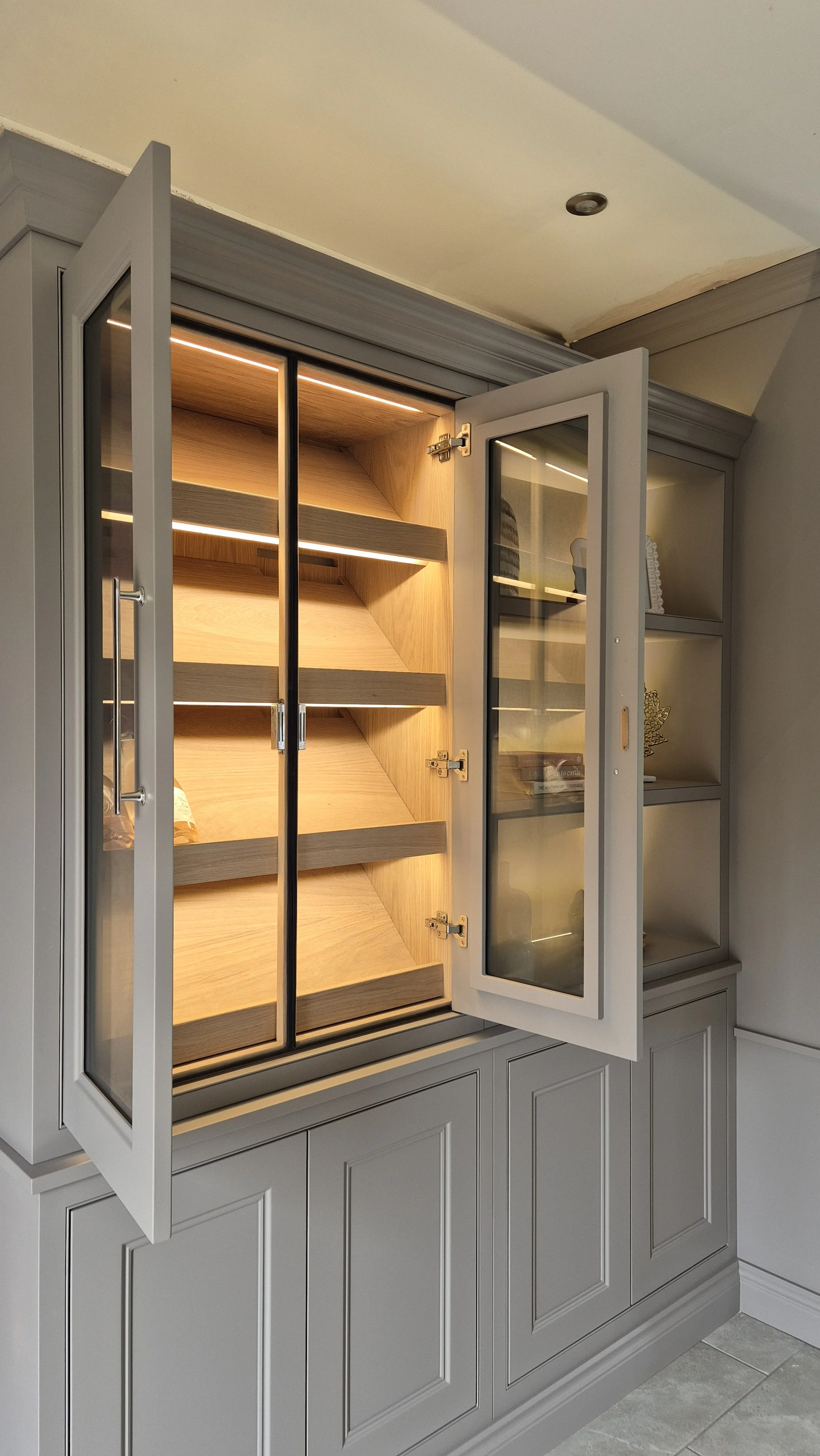 Handcrafted media wall in Knutsford with spray finish, Evonic fire, 60-inch TV, oak veneered shelves and LED lighting