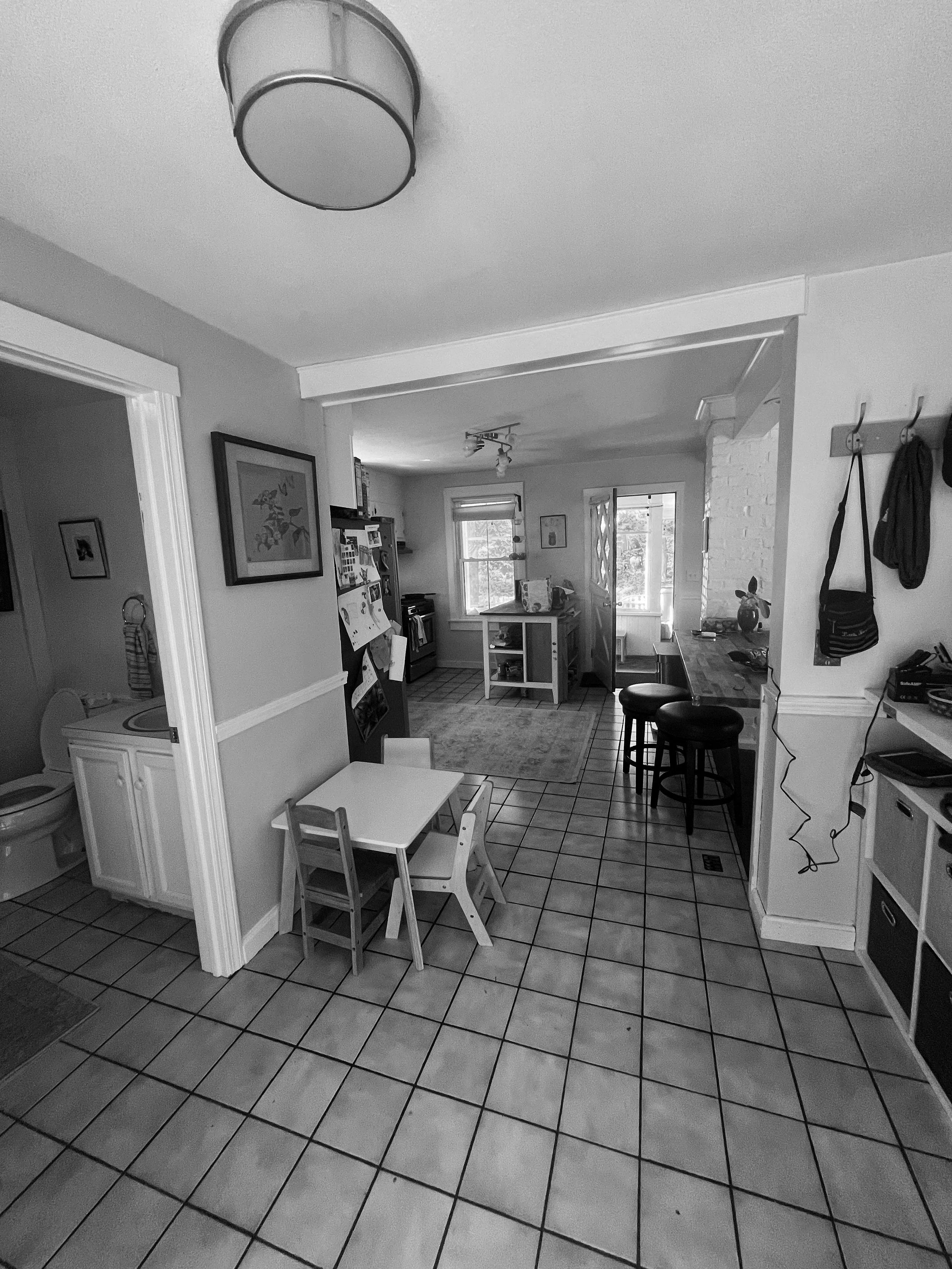BEFORE: mudroom + kitchen looking west