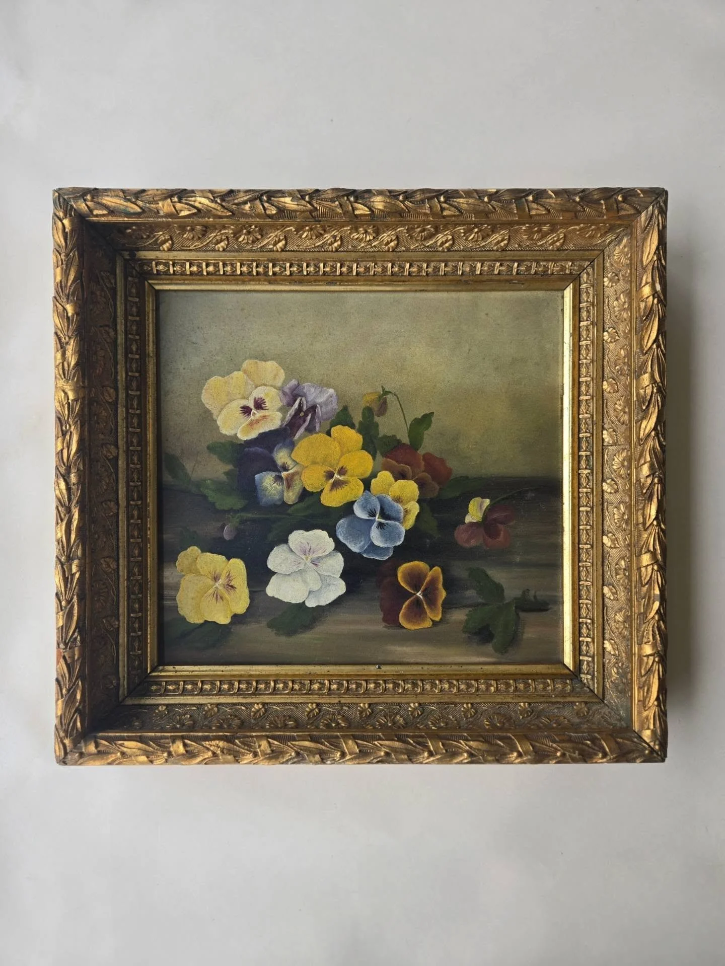 SOLD. Still Life with Pansies, c. 1880

oil on artist board, 14 1/2 x 15 1/2 in.
ornate antique gilt frame

good antique condition with minor discoloration, frame in overall good condition with several small areas of damage, largely not visible strai
