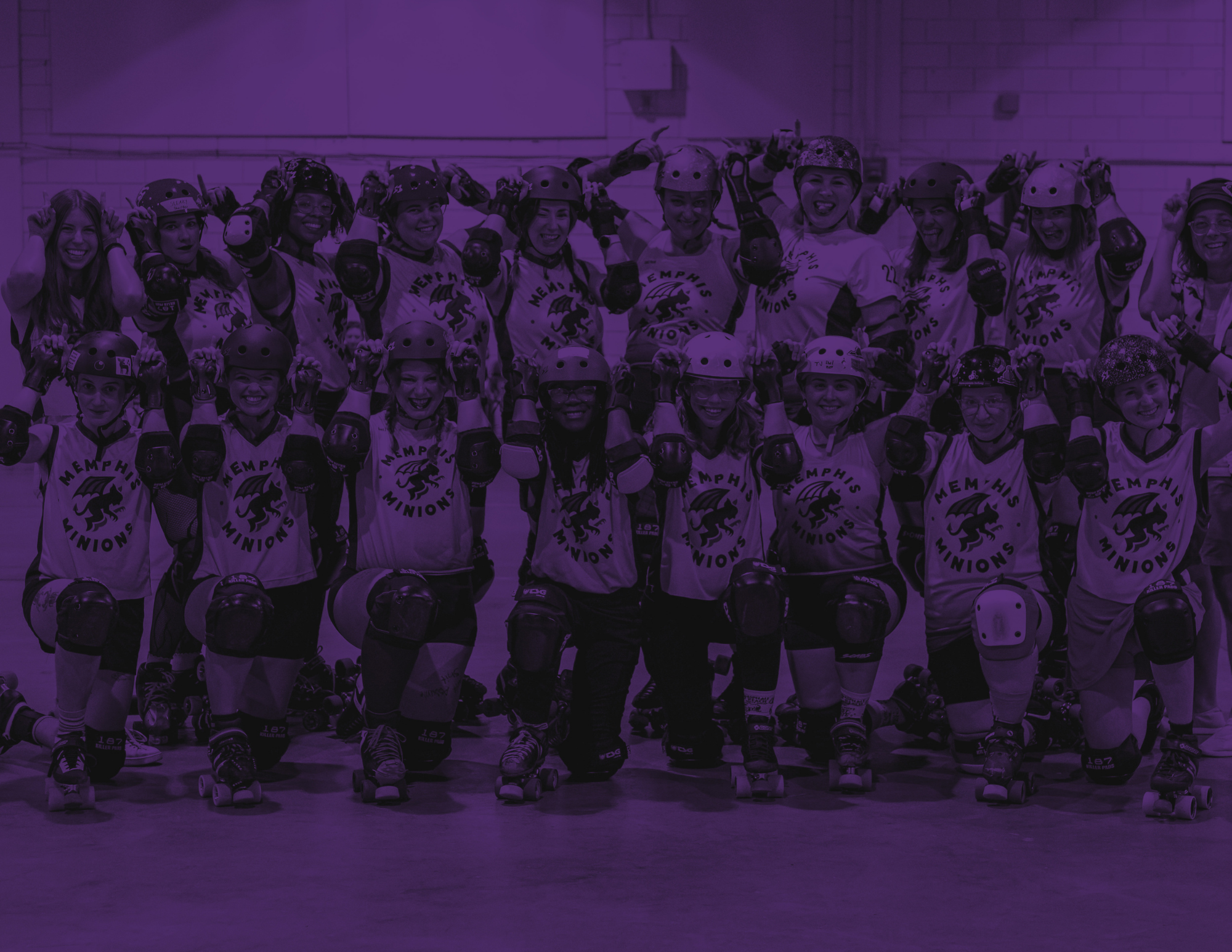 roller derby players pose for a group photo