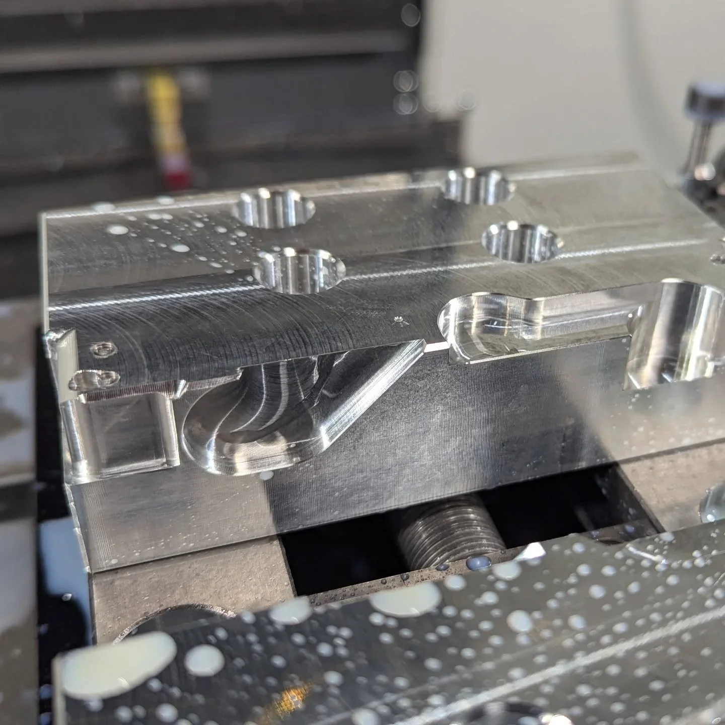 One of the more interesting soft jaws I've made to bore tight tolerance holes on these thin aluminum faces. 3D surfaced to relieve the edges of the jaw due to the relatively large internal radius on the part. Worked great, definitely worth time time 