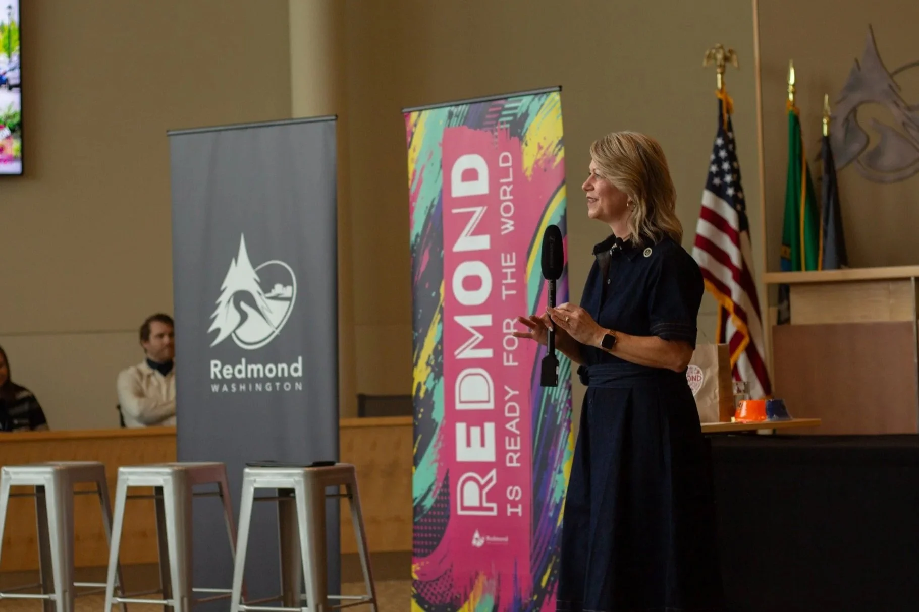Mayor Angela Birney speaks with a microphone at City Hall.