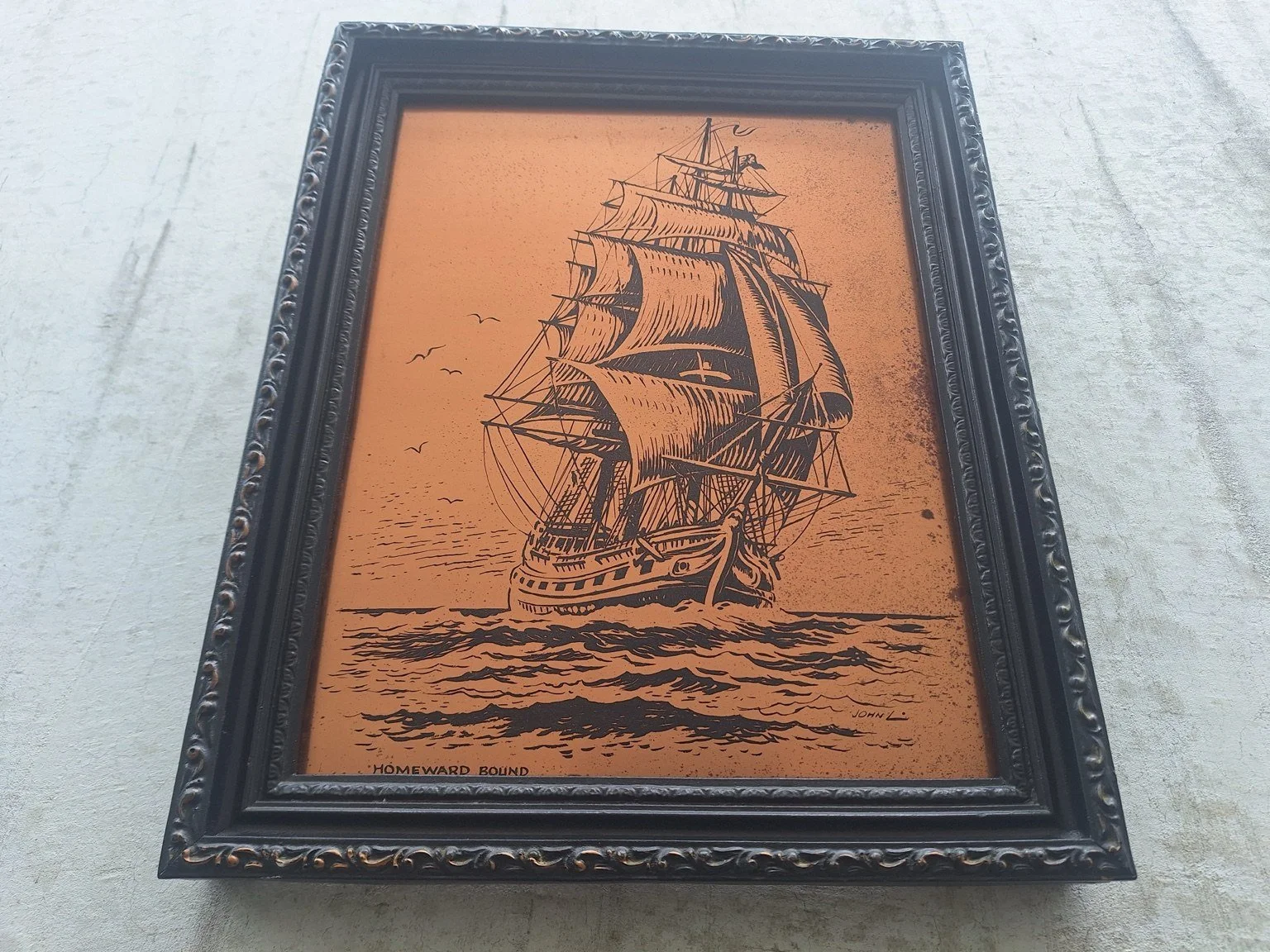 Closer view of the sailing ship, rigging and waves on the copper panel.