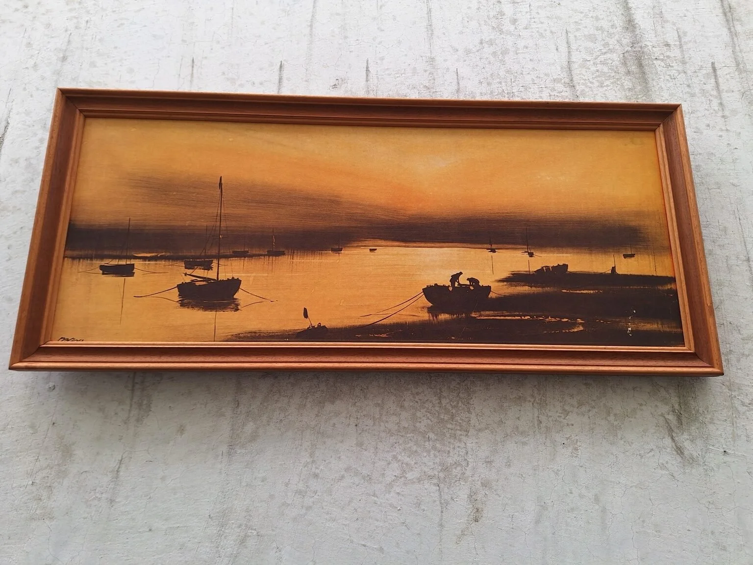 Angled overall view of the vintage harbour print and its moulded timber frame.