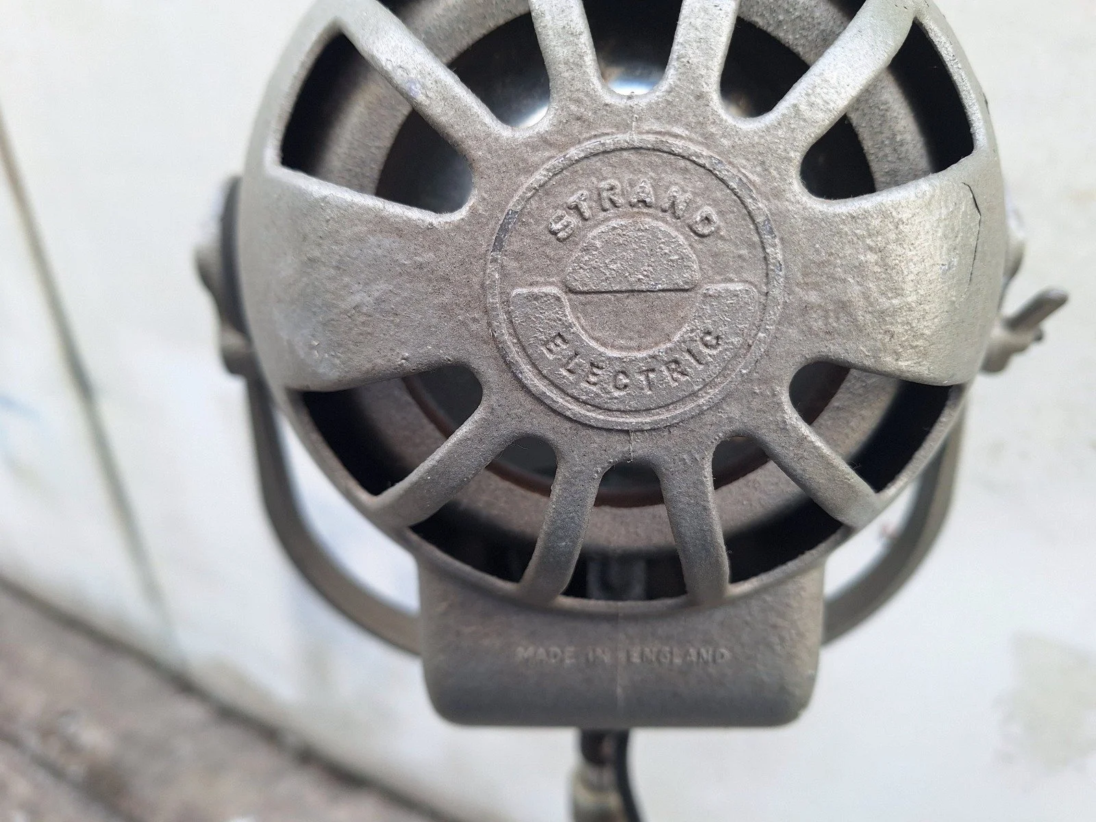 Rear casting of lamp No. 2 bearing Strand Electric branding and the Made in England mark.