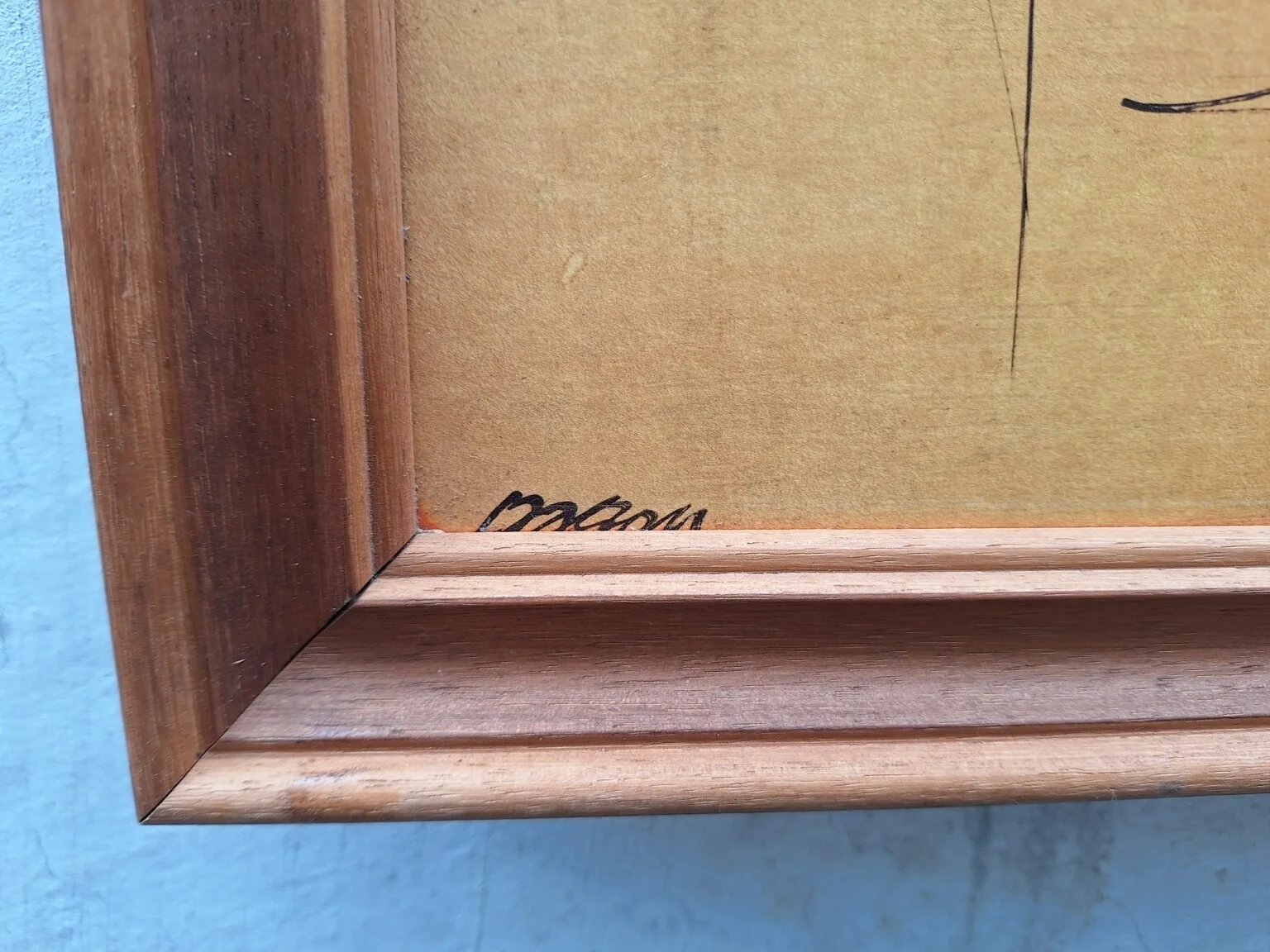 Close view of the unverified artist signature at the lower-left corner of the vintage print.