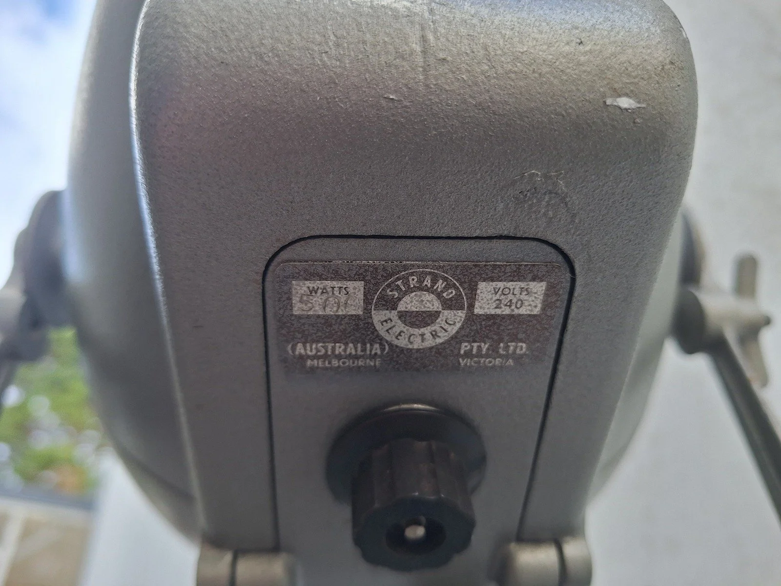 Strand Electric Australia label and worn grey finish on lamp No. 2.