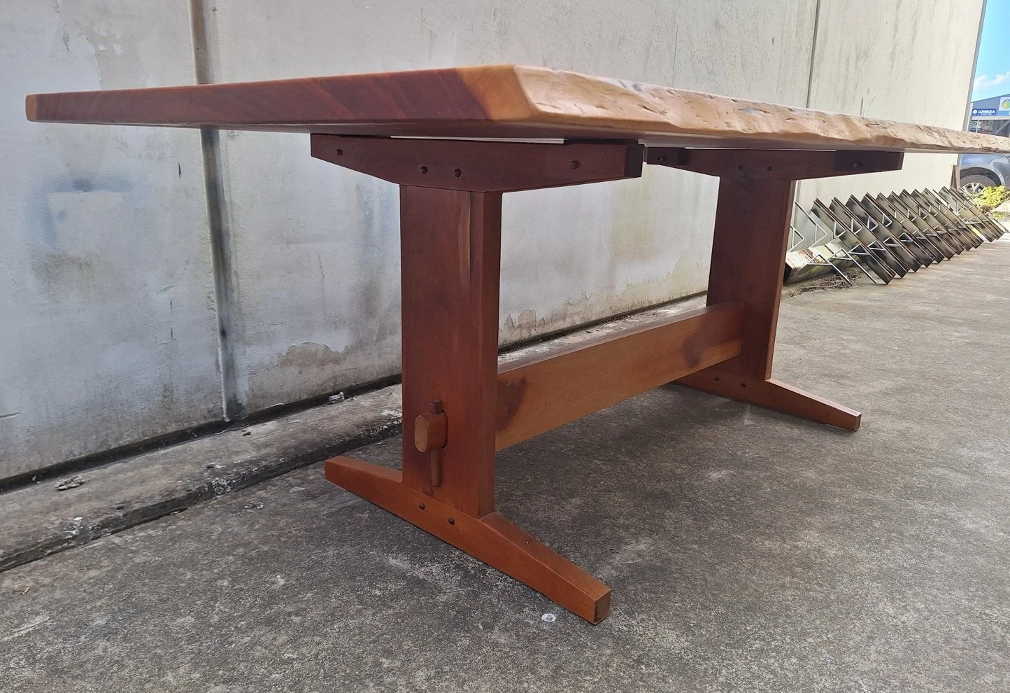 Griffith Tablecraft rosewood dining table showing solid timber trestle base