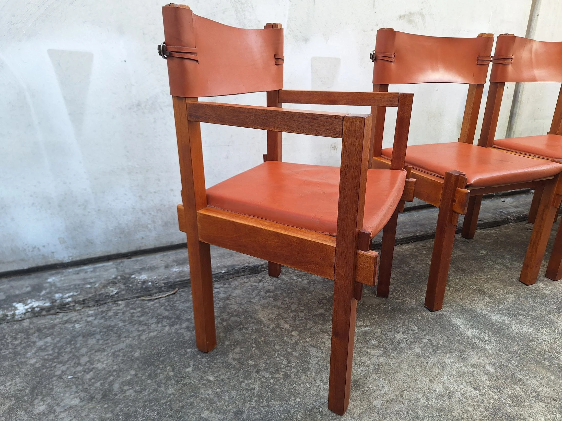 Eight Griffith Tablecraft leather and rosewood dining chairs frame