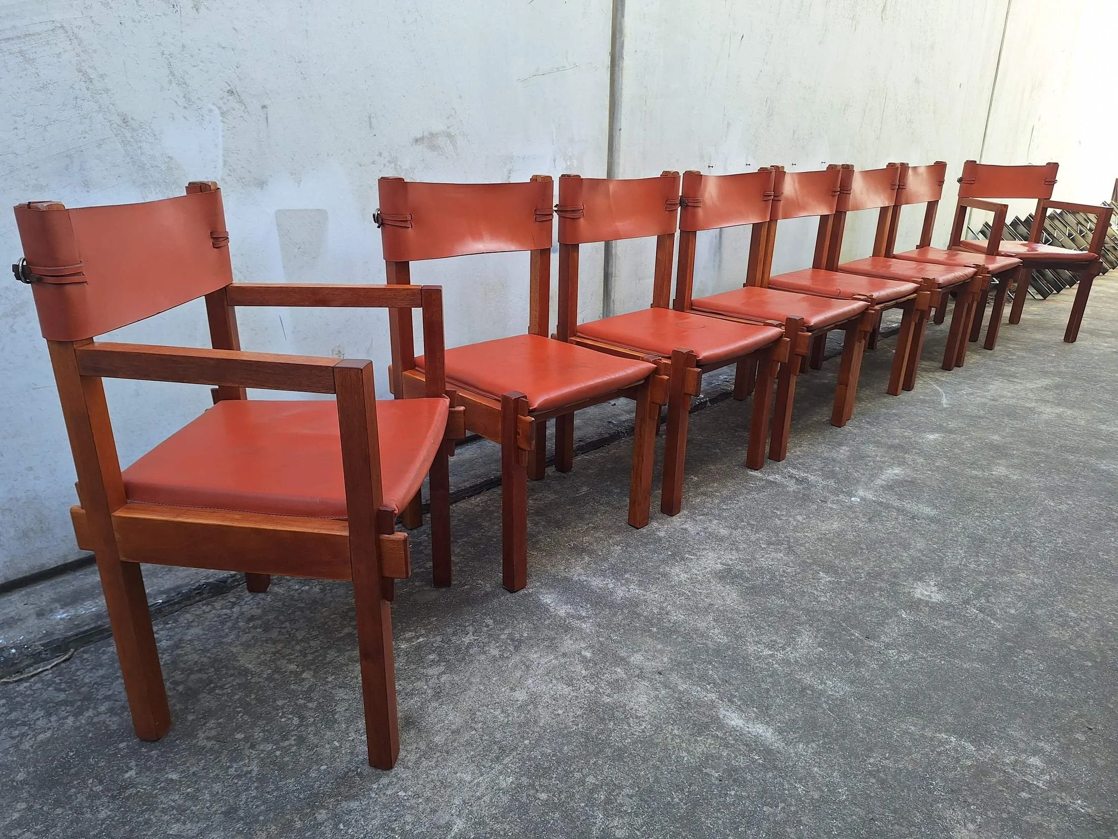 Eight Griffith Tablecraft leather and rosewood dining chairs