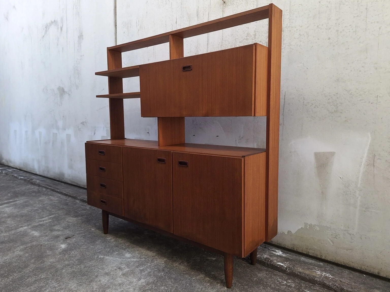 Restored vintage mid-century wall unit and double-sided room divider viewed from the front right