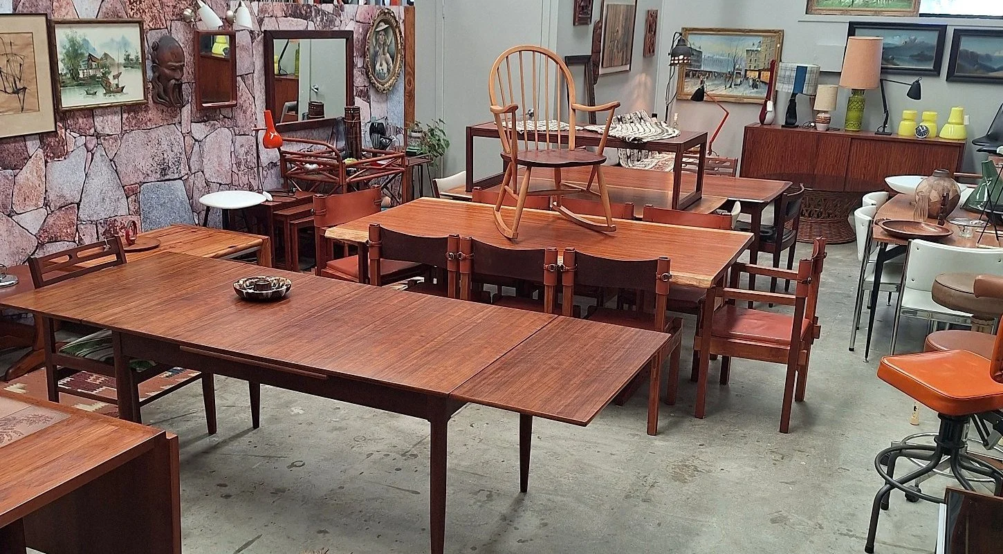 Kush Interiors showroom in South Murwillumbah with restored mid-century dining tables, chairs, lighting and art