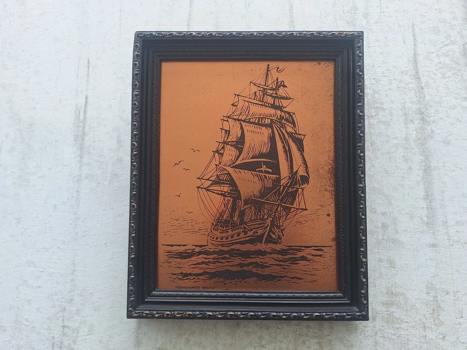 Front view of Homeward Bound copper artwork depicting a sailing ship in a dark decorative frame.