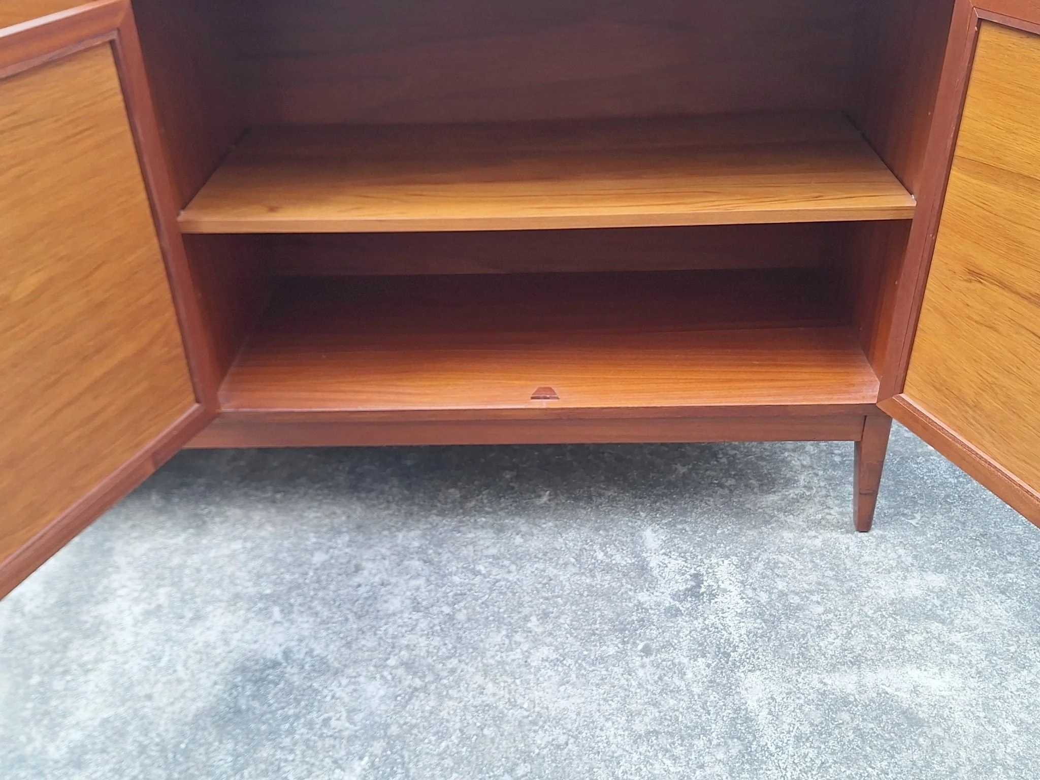 Professionally restored mid century timber sideboard with four drawers, tan vinyl inlay cabinet doors and adjustable shelving.