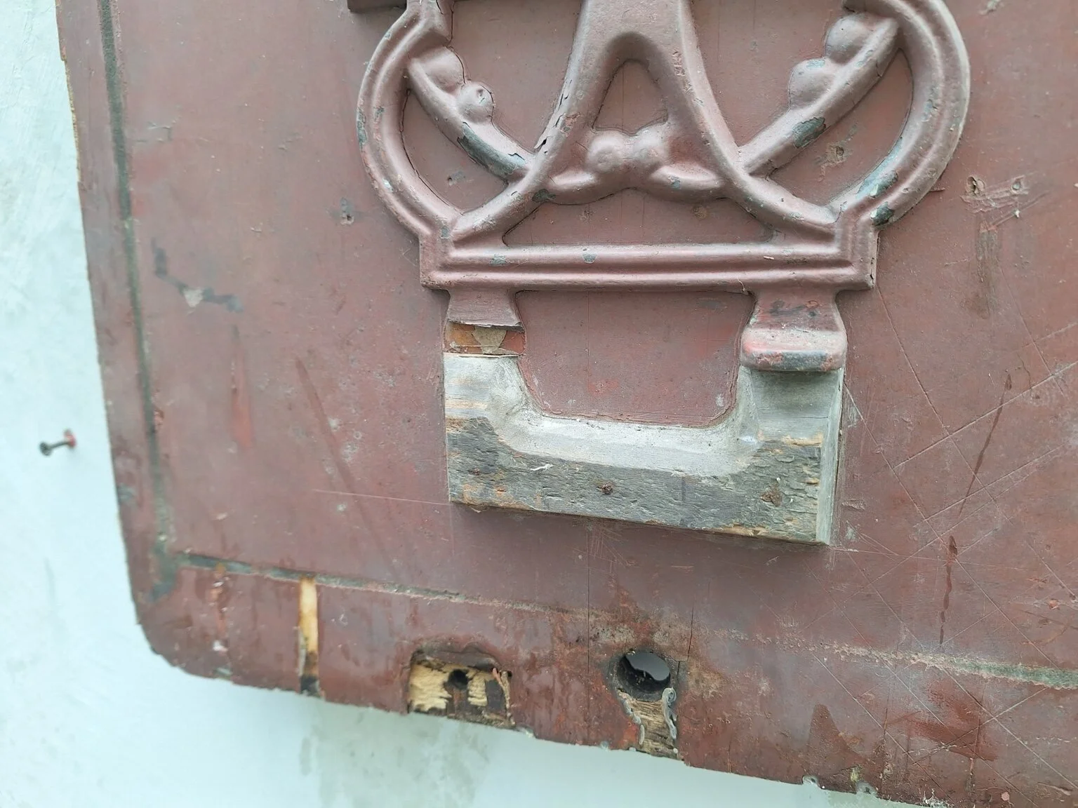 Lower section showing surface wear, fixing holes and loose pattern component