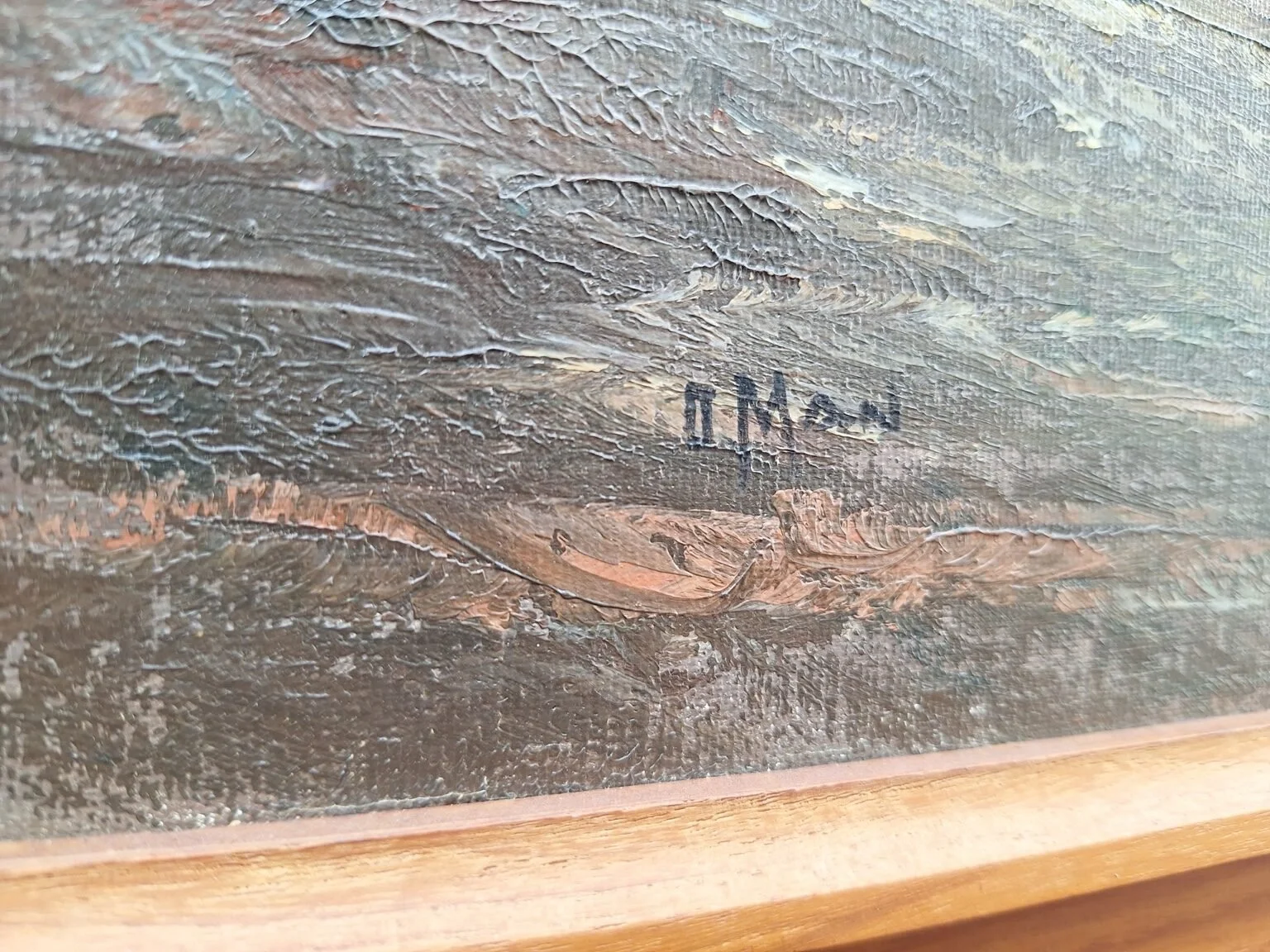 Close view of the artist’s painted signature on the lower section of the vintage oil painting.