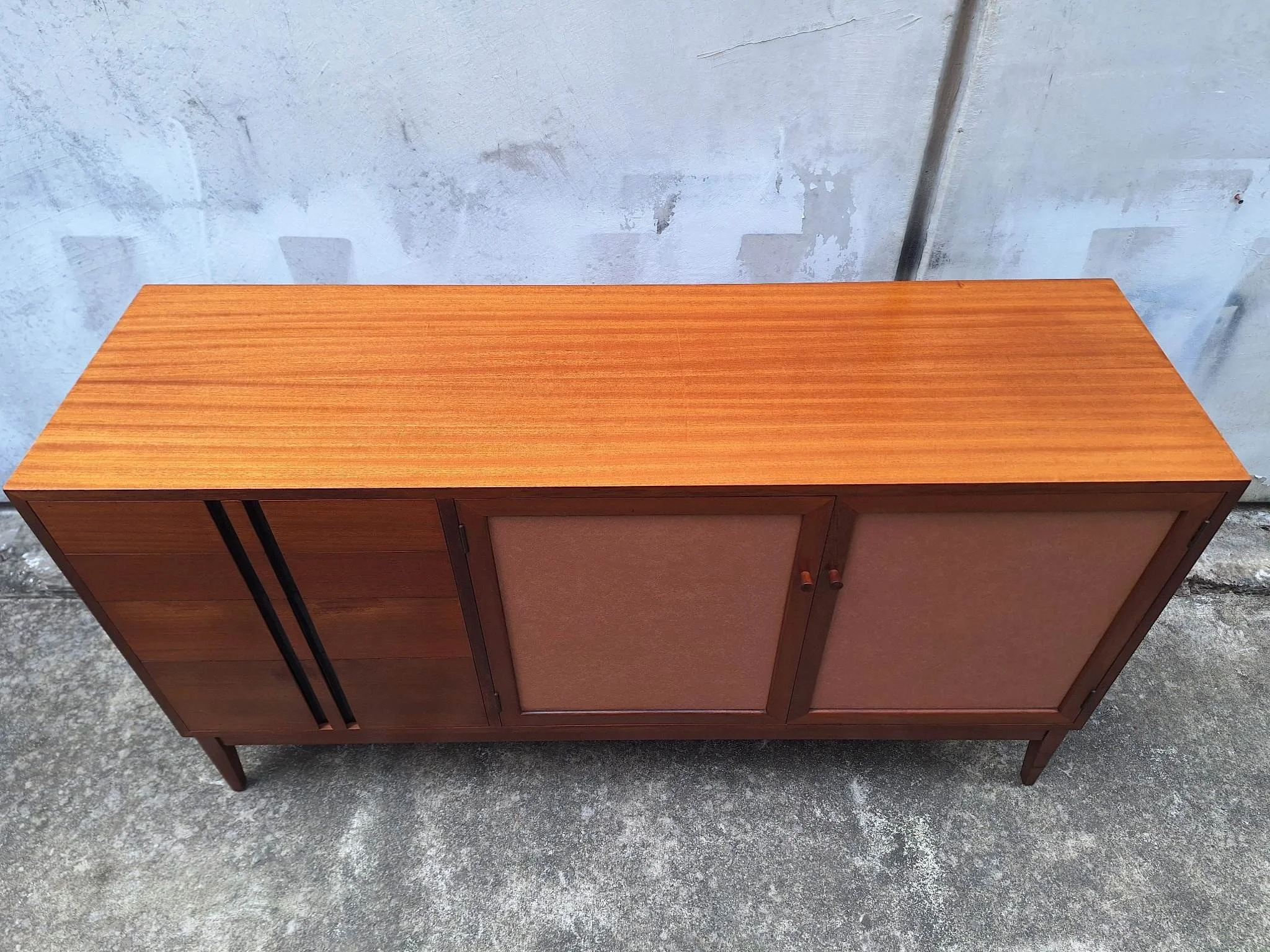 Professionally restored mid century timber sideboard with four drawers, tan vinyl inlay cabinet doors and adjustable shelving.
