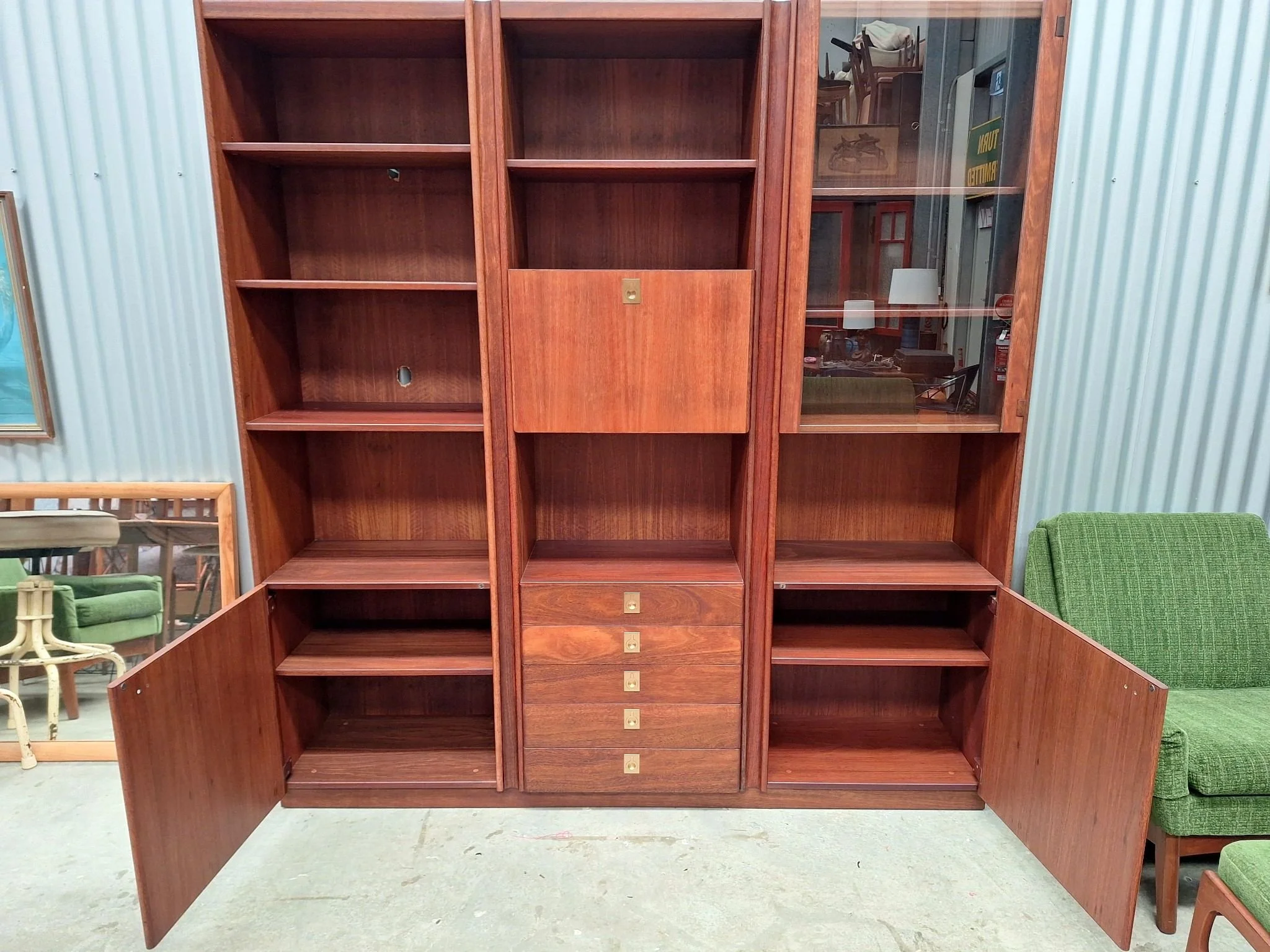 kush interiors mid-century teak wall unit storage open