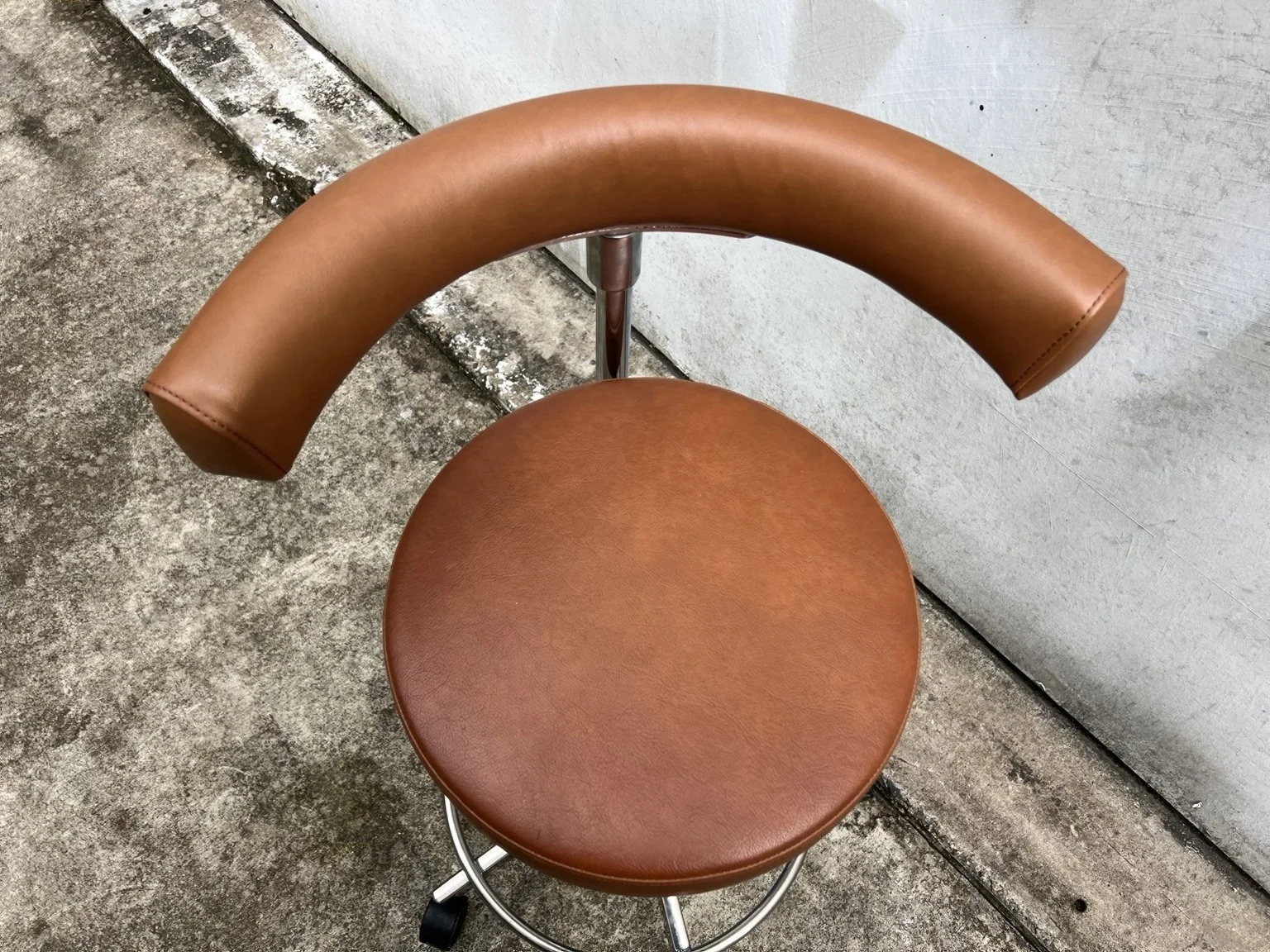 Mid century adjustable stool with tan leather seat and chrome base