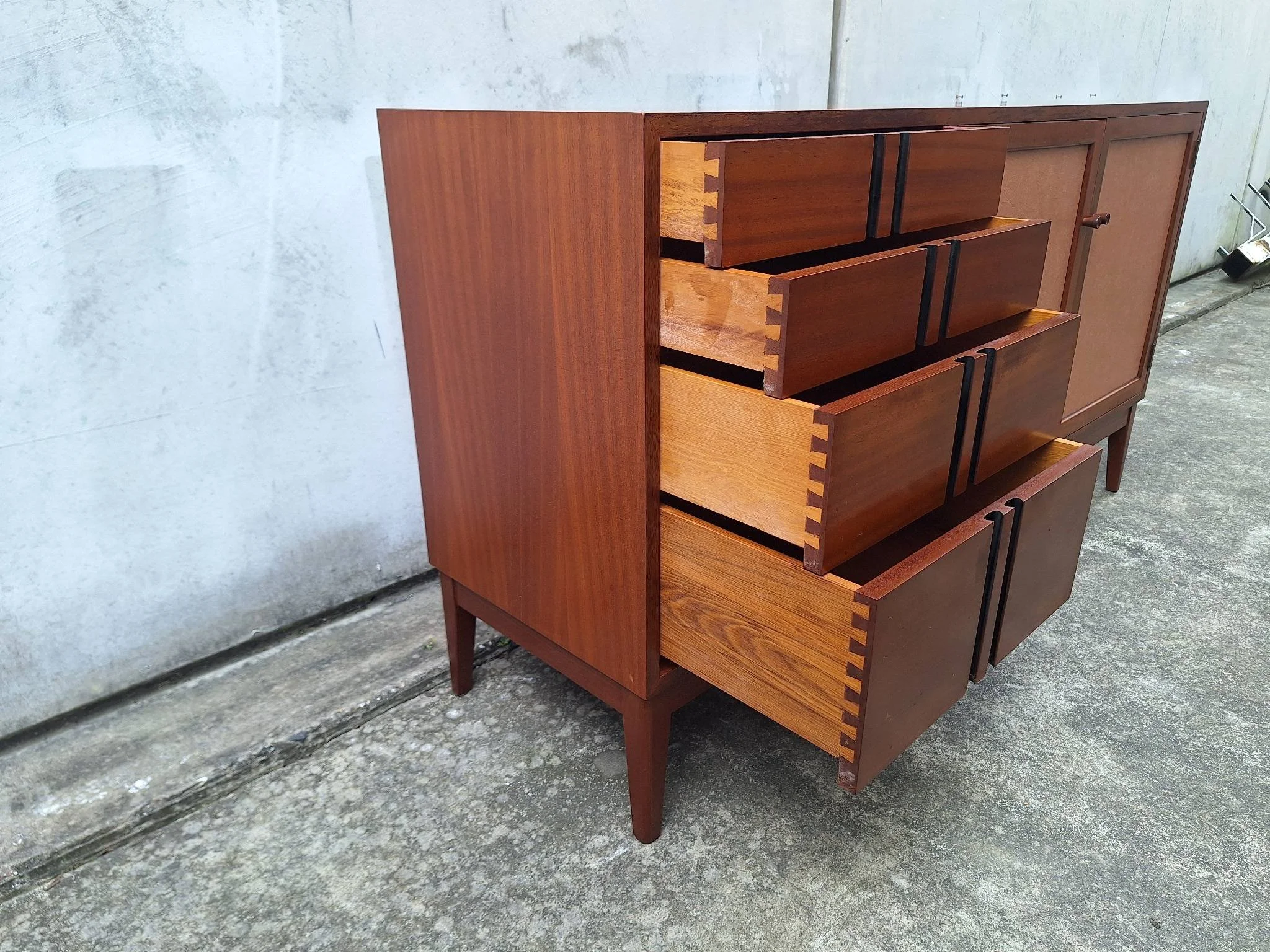 Professionally restored mid century timber sideboard with four drawers, tan vinyl inlay cabinet doors and adjustable shelving.