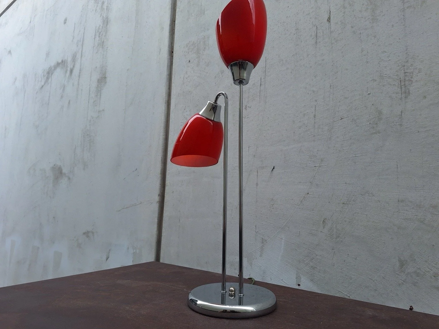 Side view of the twin-shade lamp showing the staggered shade heights.