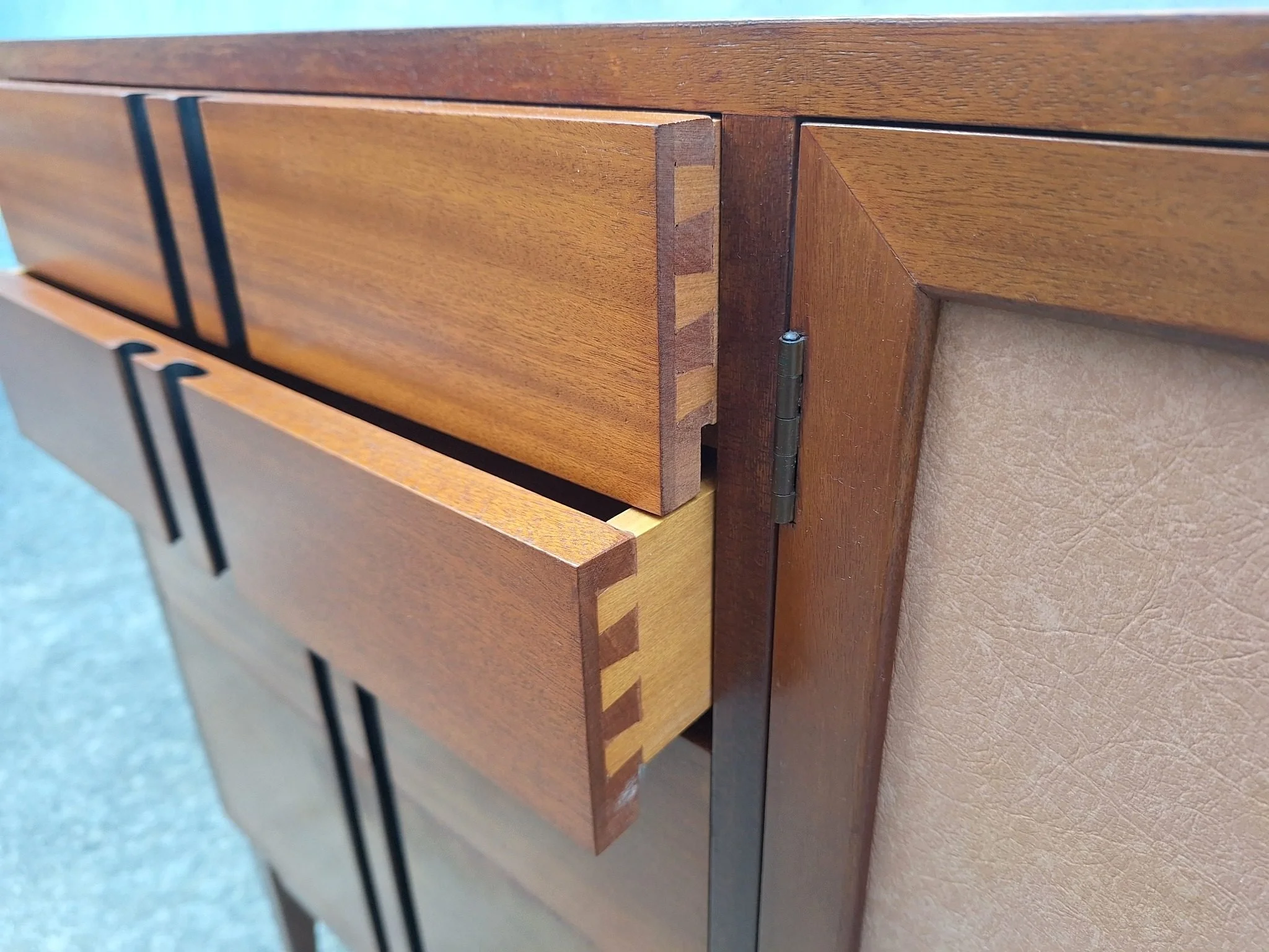 Professionally restored mid century timber sideboard with four drawers, tan vinyl inlay cabinet doors and adjustable shelving.