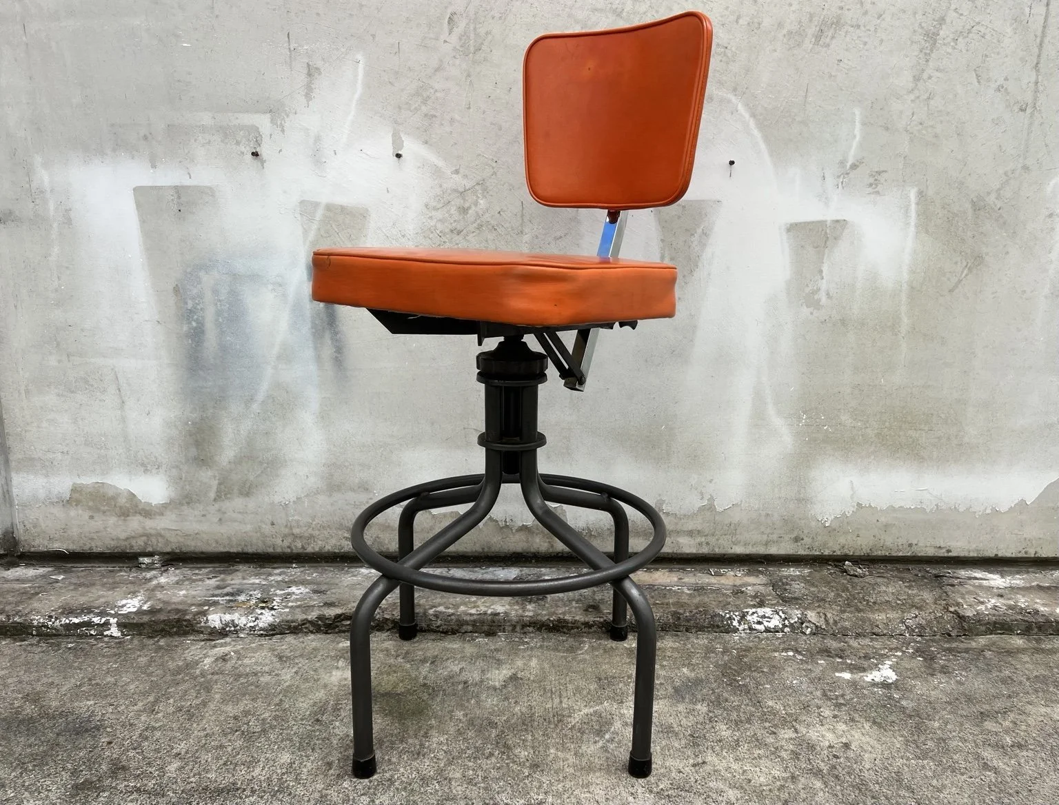 kush interiors industrial adjustable stool orange 01