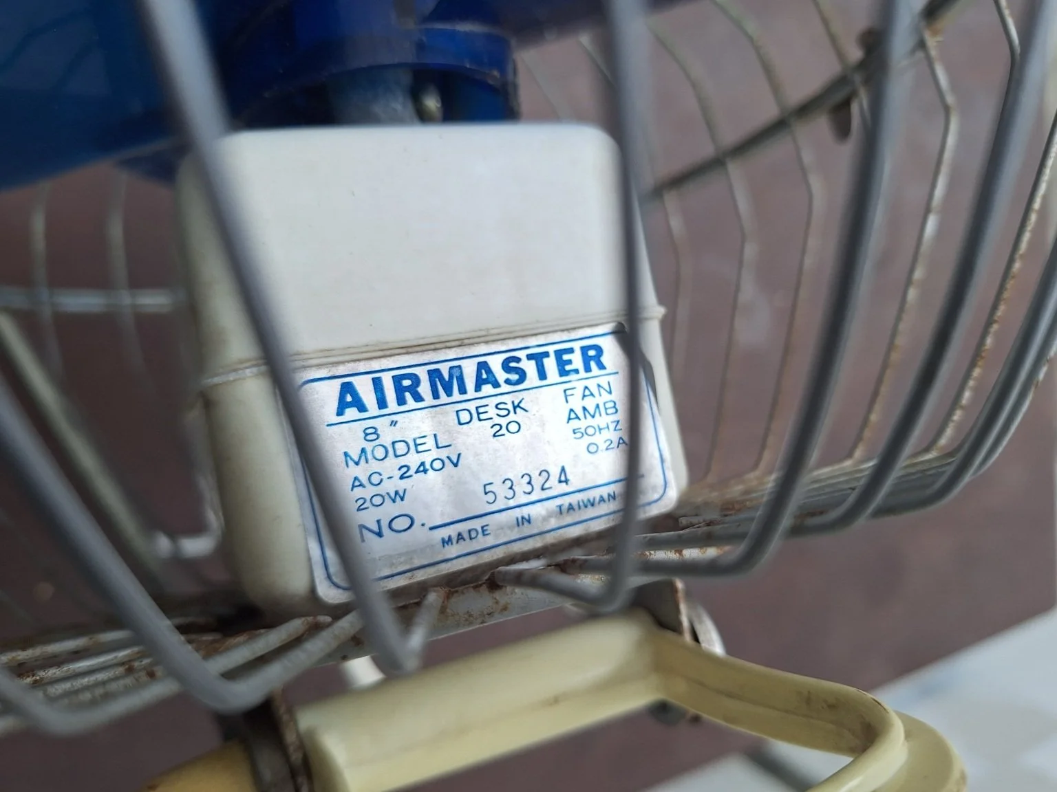 Airmaster maker label identifying an 8-inch desk fan, 240 volts, 20 watts and manufacture in Taiwan.
